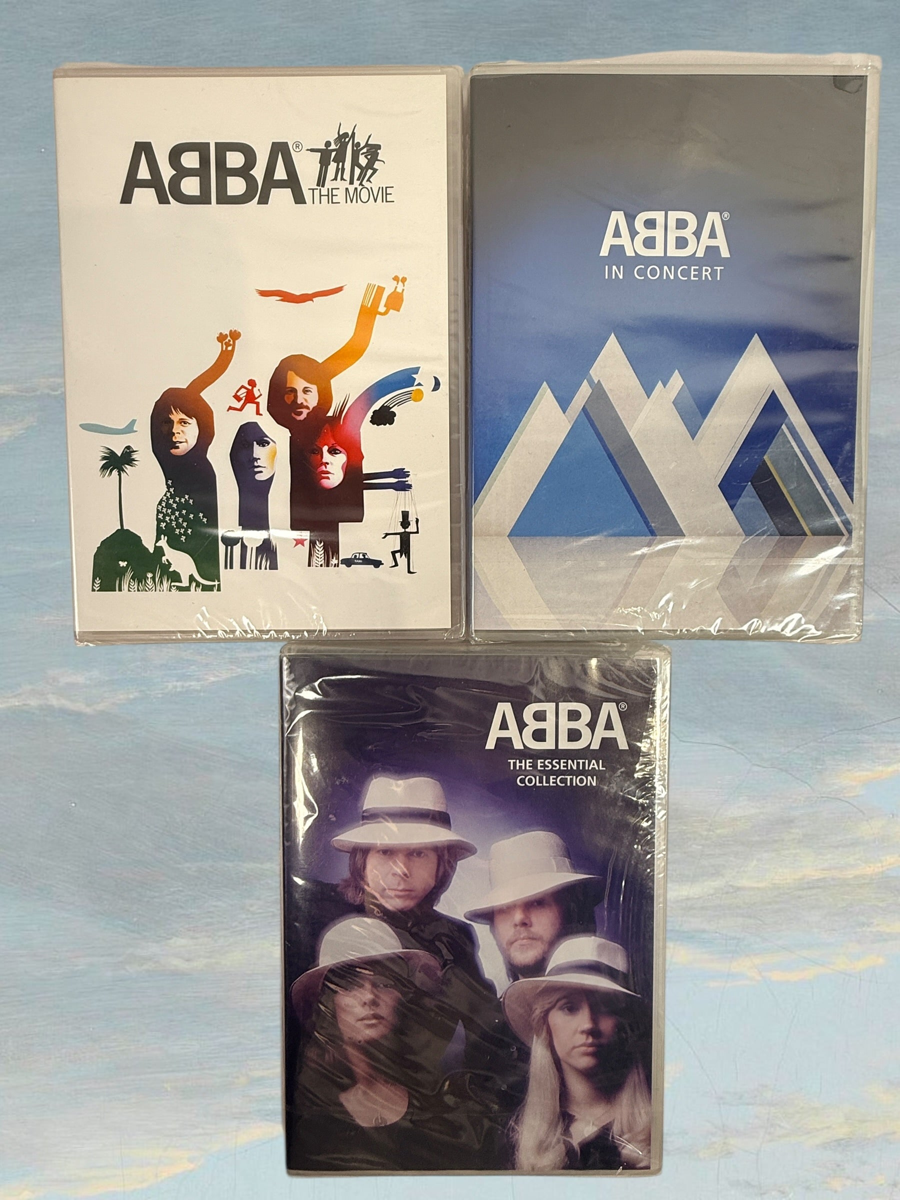 ABBA DVD bundle including The Movie, In Concert, and Essential Collection. Sealed music documentaries featuring classic performances and greatest hits.