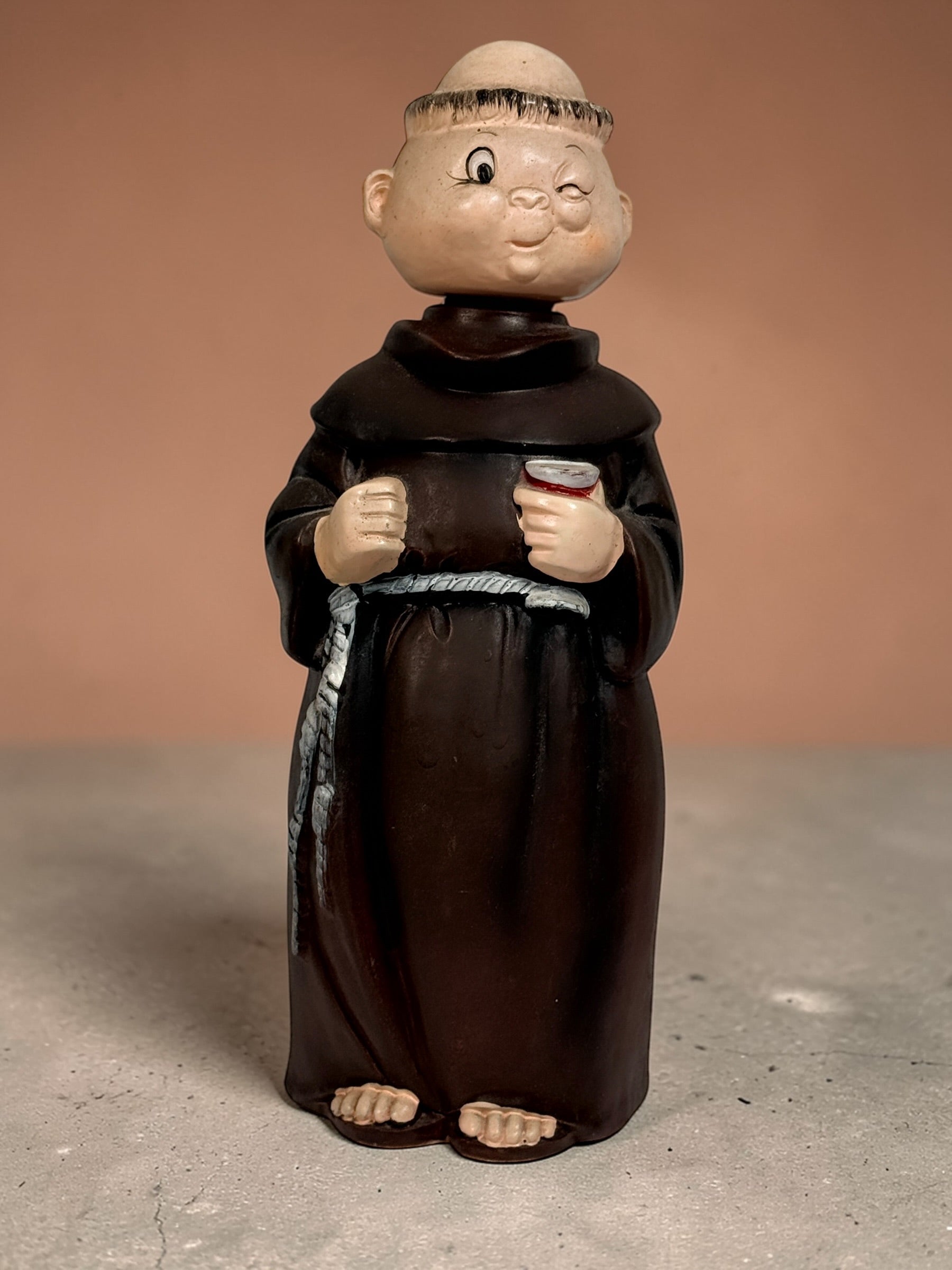 Vintage monk musical figurine wind-up music box winking friar ceramic collectible decor 1970s kitsch religious statue working mechanism unique gift.