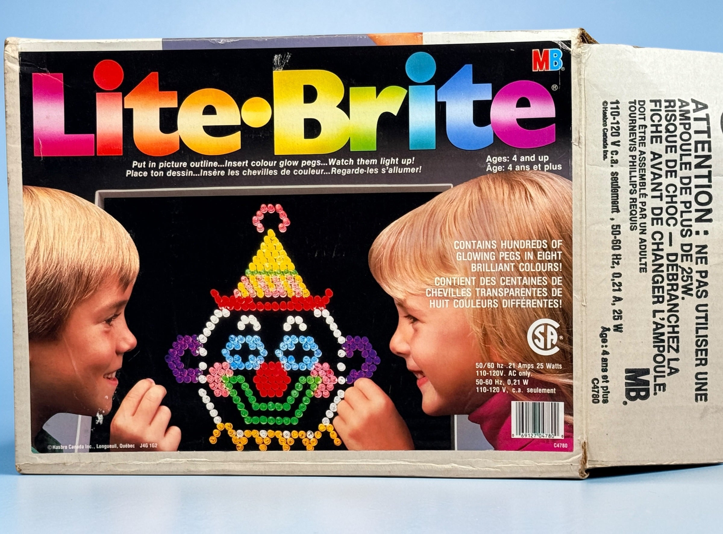 Vintage 1987 Lite-Brite Milton Bradley C4780 boxed set with pegs, 22 design sheets, and 20 blanks. Classic retro toy in very good condition.