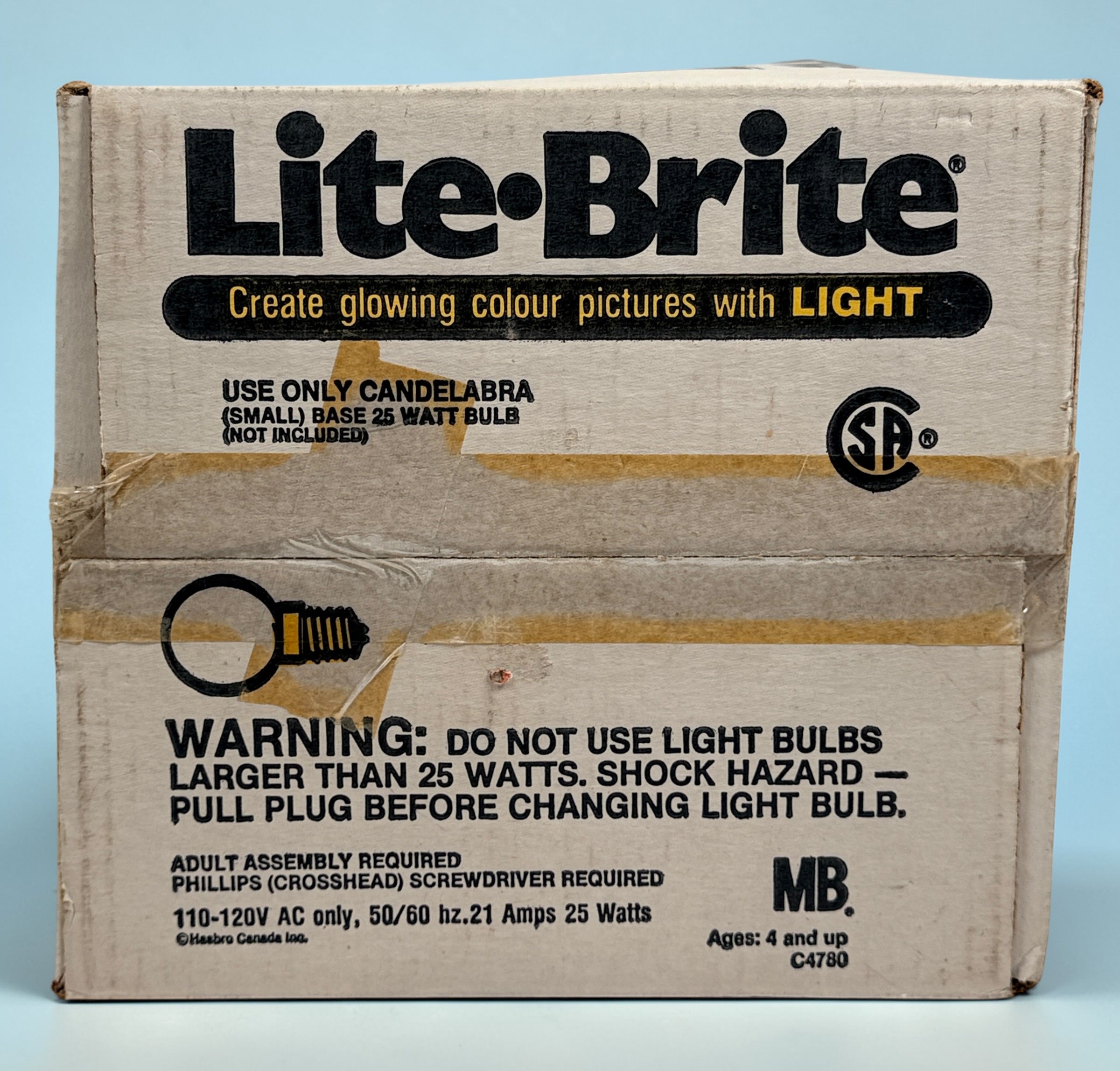 Vintage 1987 Lite-Brite Milton Bradley C4780 boxed set with pegs, 22 design sheets, and 20 blanks. Classic retro toy in very good condition.