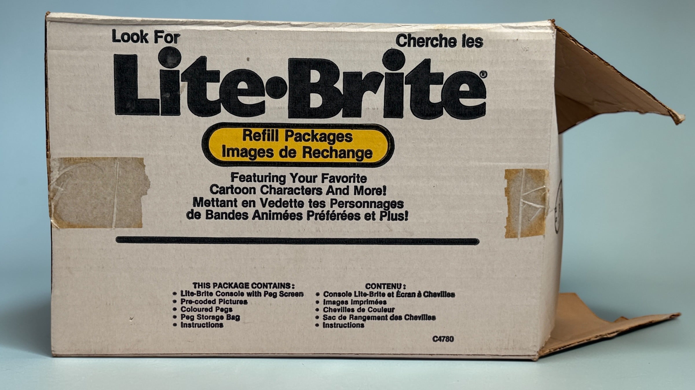 Vintage 1987 Lite-Brite Milton Bradley C4780 boxed set with pegs, 22 design sheets, and 20 blanks. Classic retro toy in very good condition.