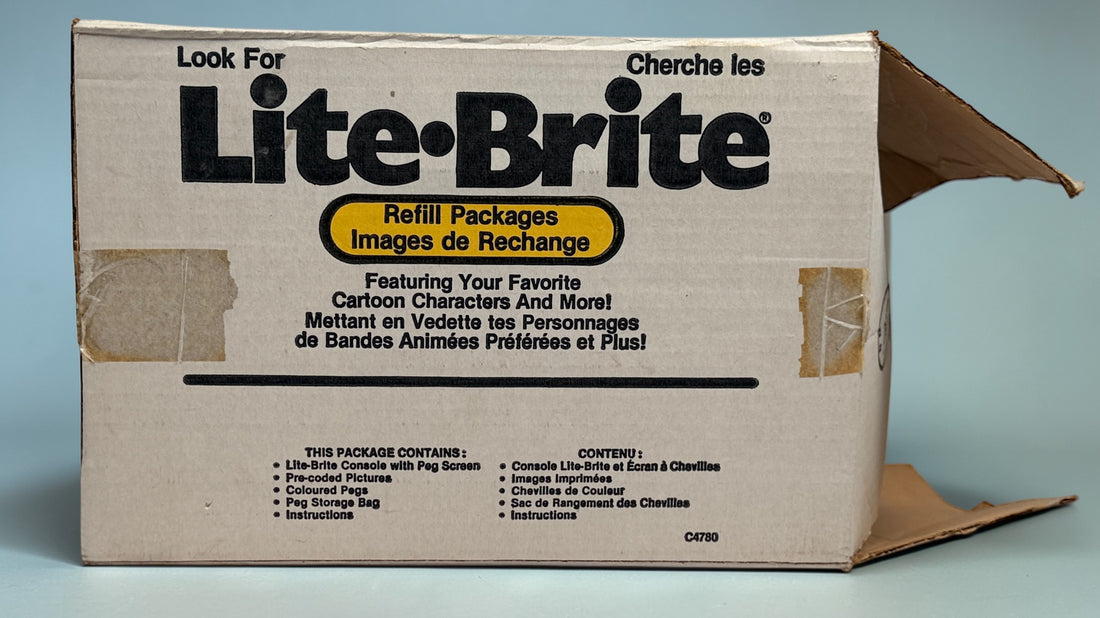 Vintage 1987 Lite-Brite Milton Bradley C4780 boxed set with pegs, 22 design sheets, and 20 blanks. Classic retro toy in very good condition.
