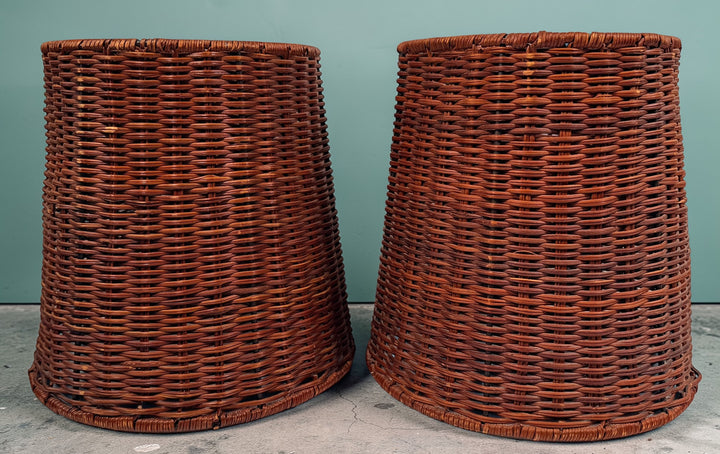 Pair of vintage rattan lamp shades in woven boho style. Drum shape with spider fitter, perfect for table or floor lamps and warm natural decor interiors.