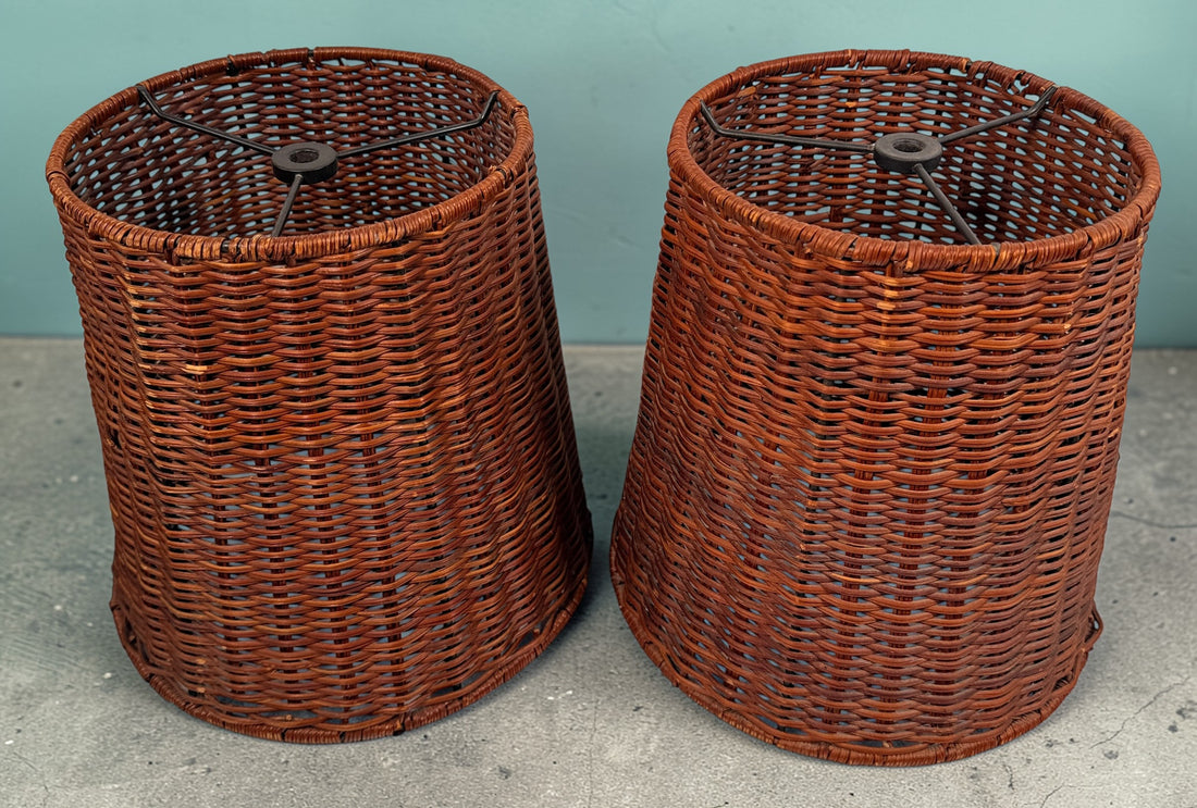 Pair of vintage rattan lamp shades in woven boho style. Drum shape with spider fitter, perfect for table or floor lamps and warm natural decor interiors.