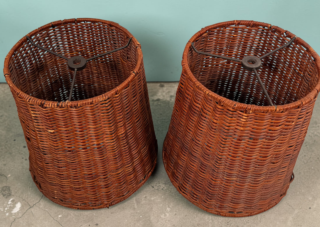 Pair of vintage rattan lamp shades in woven boho style. Drum shape with spider fitter, perfect for table or floor lamps and warm natural decor interiors.