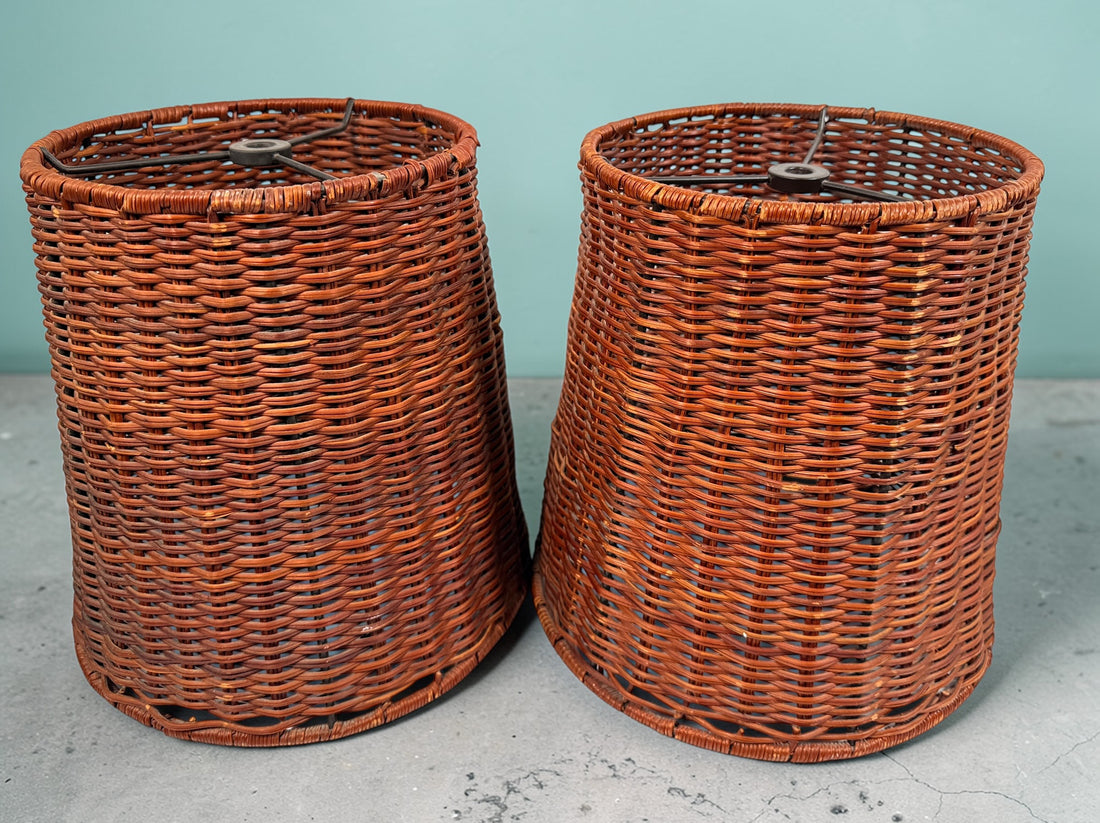 Pair of vintage rattan lamp shades in woven boho style. Drum shape with spider fitter, perfect for table or floor lamps and warm natural decor interiors.
