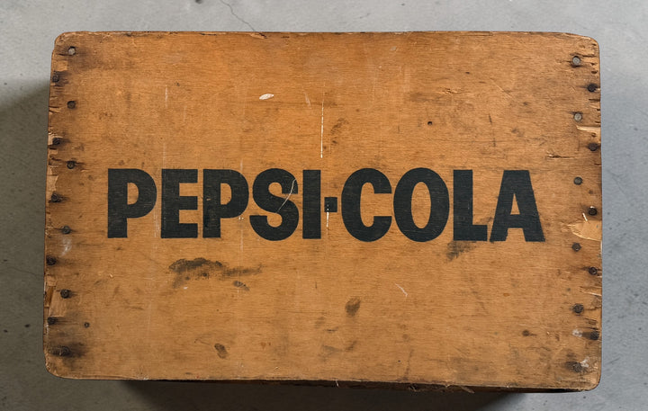 Vintage Pepsi-Cola wooden crate from Canada with classic stencil branding. Rustic decor piece perfect for storage or display in farmhouse or vintage spaces.