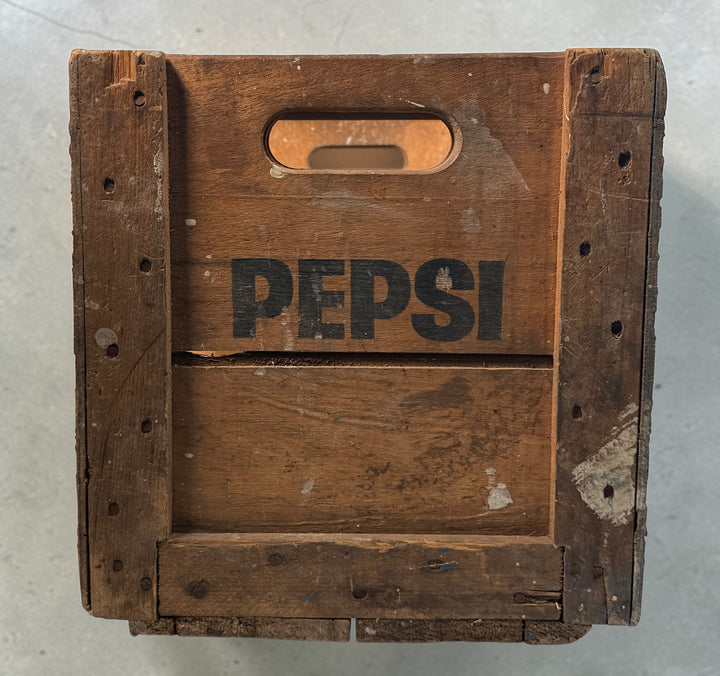 Vintage Pepsi-Cola wooden crate from Canada with classic stencil branding. Rustic decor piece perfect for storage or display in farmhouse or vintage spaces.