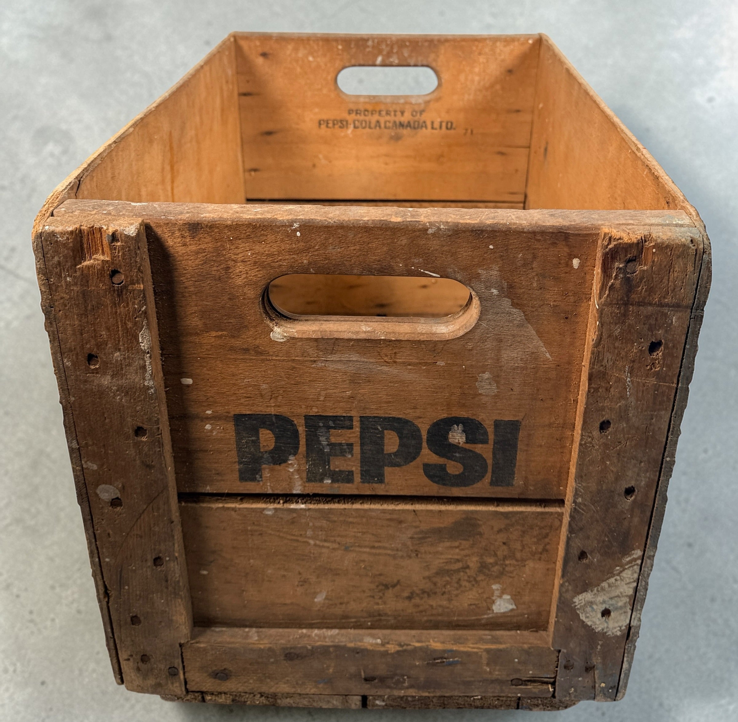 Vintage Pepsi-Cola wooden crate from Canada with classic stencil branding. Rustic decor piece perfect for storage or display in farmhouse or vintage spaces.