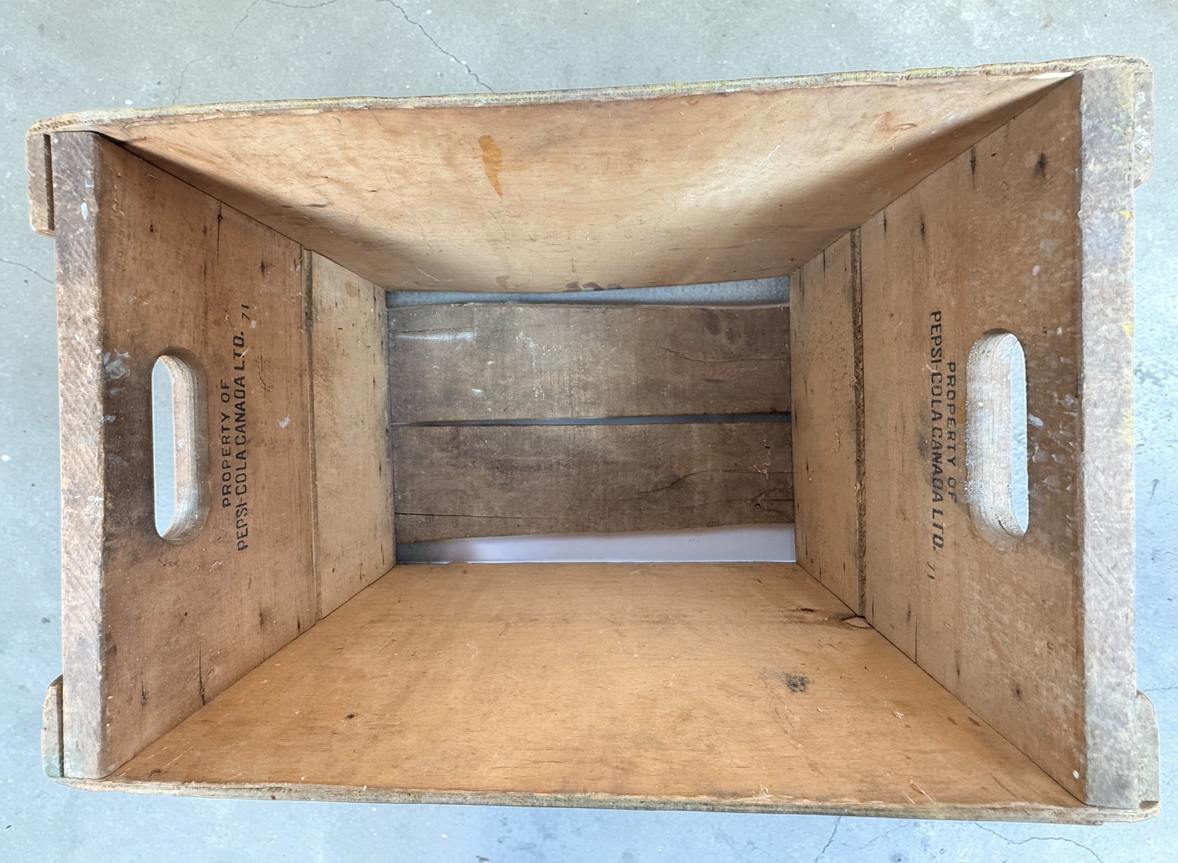 Vintage Pepsi-Cola wooden crate from Canada with classic stencil branding. Rustic decor piece perfect for storage or display in farmhouse or vintage spaces.