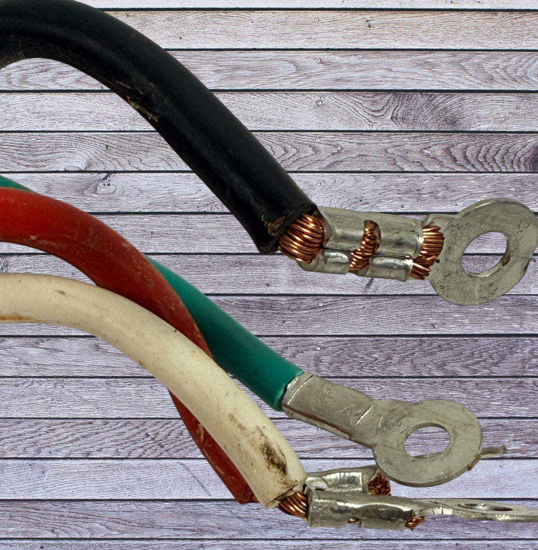 Used 4-prong stove power cord NEMA 14-50 heavy duty 240V range cable with ring terminals. Ideal for replacement or repair applications.