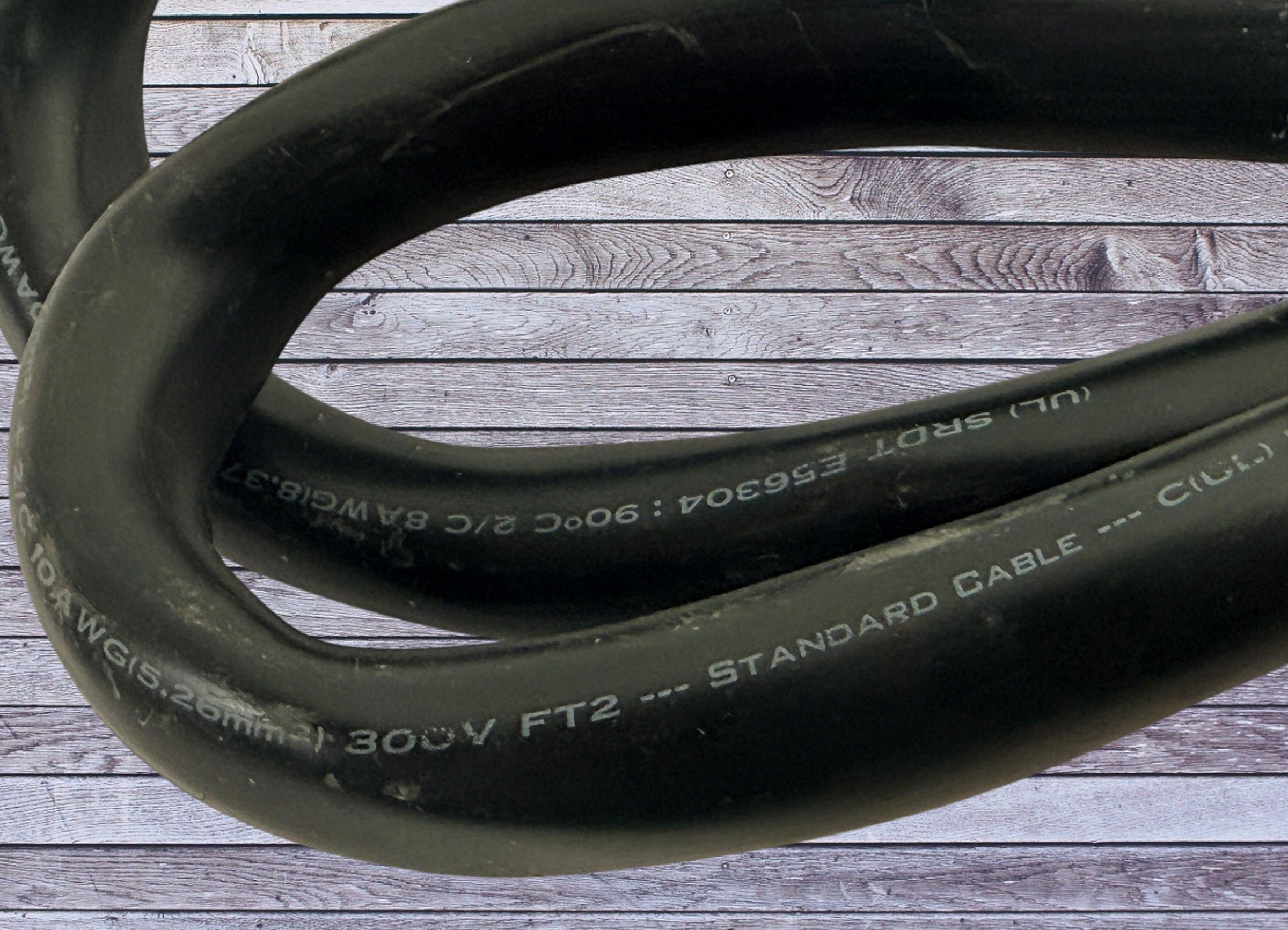 Used 4-prong stove power cord NEMA 14-50 heavy duty 240V range cable with ring terminals. Ideal for replacement or repair applications.