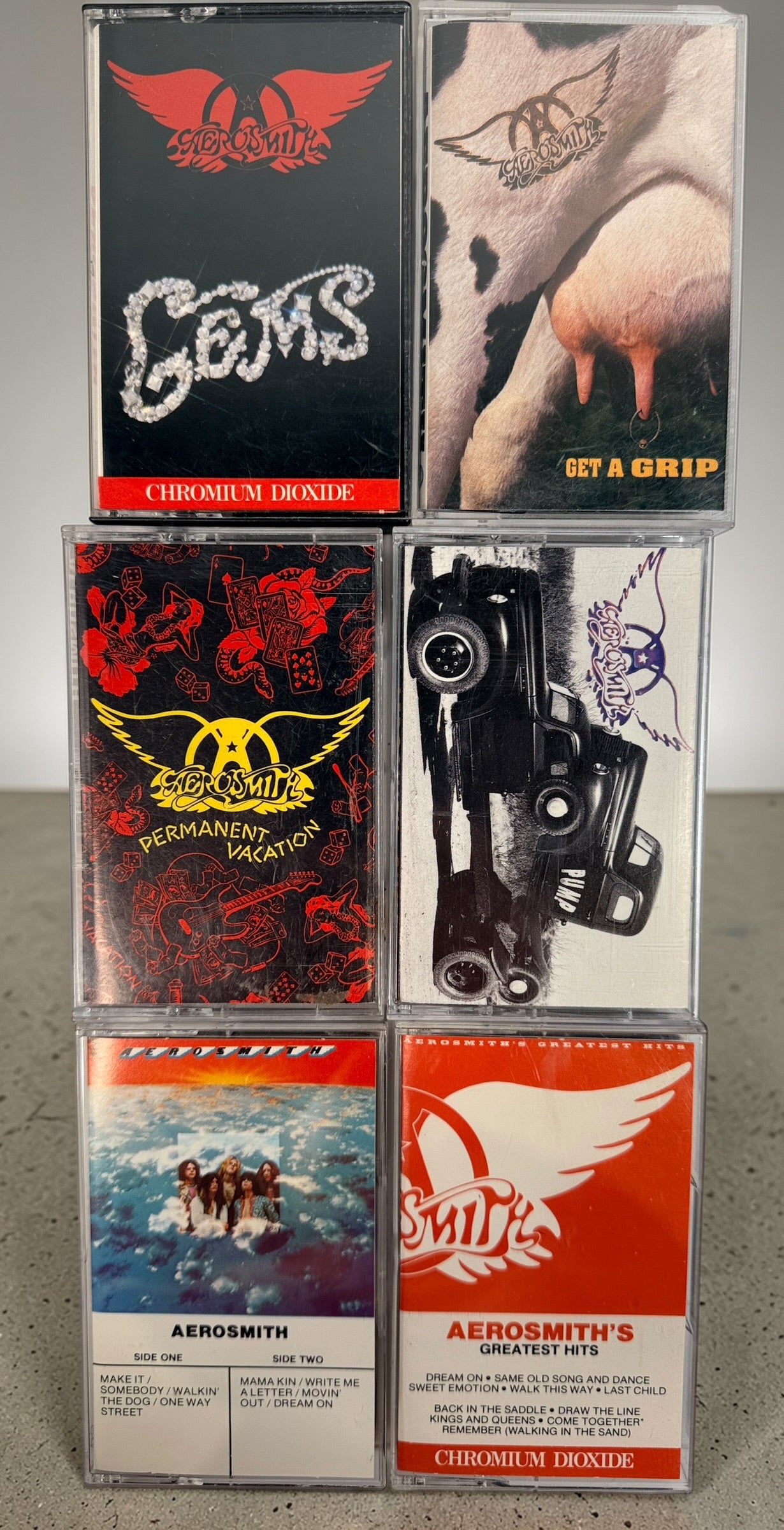 Vintage Aerosmith cassette lot with 6 classic albums including Pump and Get a Grip. Columbia and Geffen releases, perfect for collectors and retro audio setups.