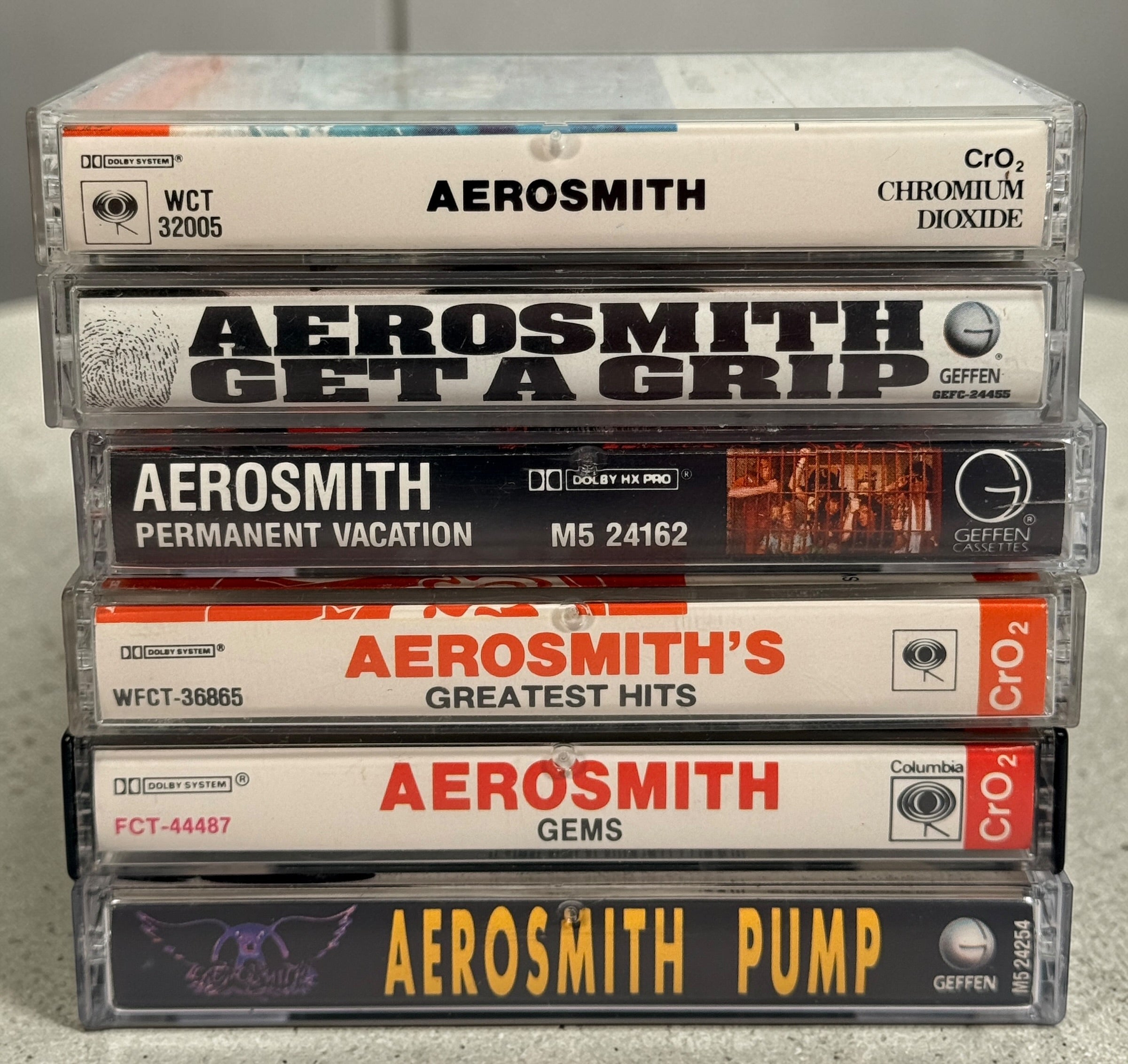 Vintage Aerosmith cassette lot with 6 classic albums including Pump and Get a Grip. Columbia and Geffen releases, perfect for collectors and retro audio setups.