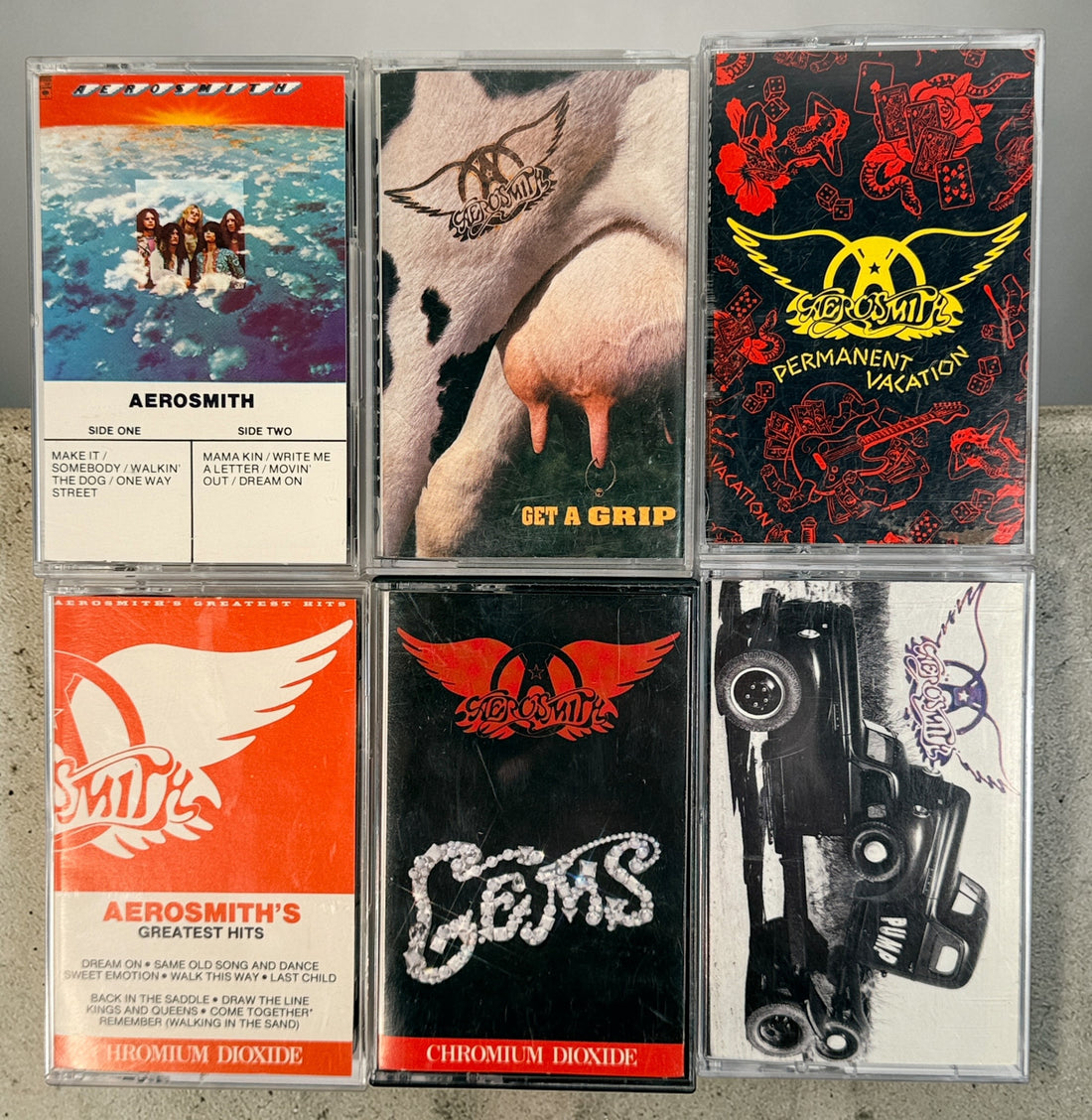 Vintage Aerosmith cassette lot with 6 classic albums including Pump and Get a Grip. Columbia and Geffen releases, perfect for collectors and retro audio setups.