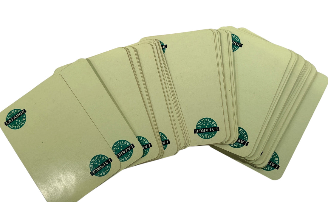 Vintage Lafarge French playing cards advertising deck with joker and original box. Mid-century collectible industrial promo cards in usable condition.
