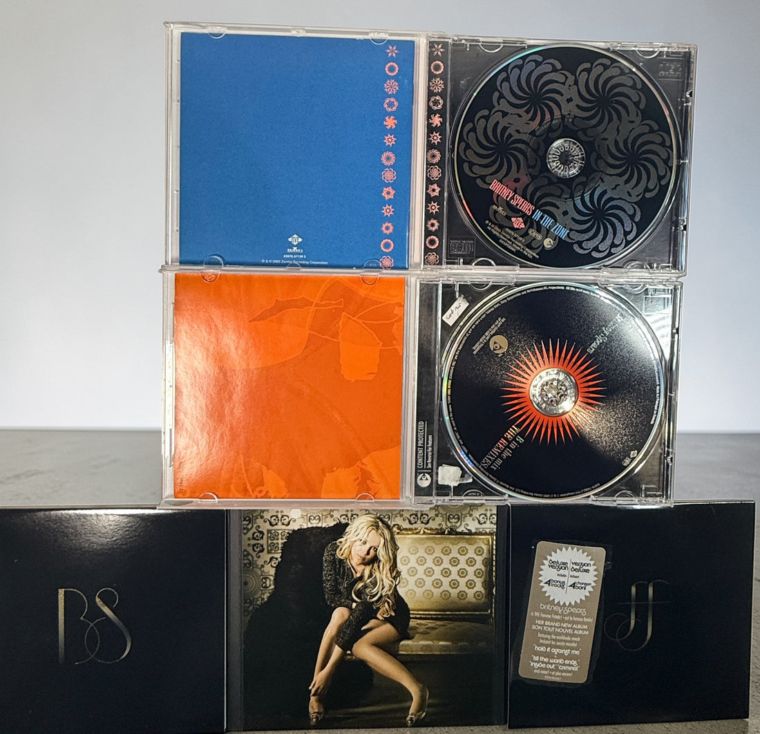 Britney Spears CD lot with Femme Fatale deluxe, In The Zone and remix album. Affordable pop bundle with original packaging and inserts included.