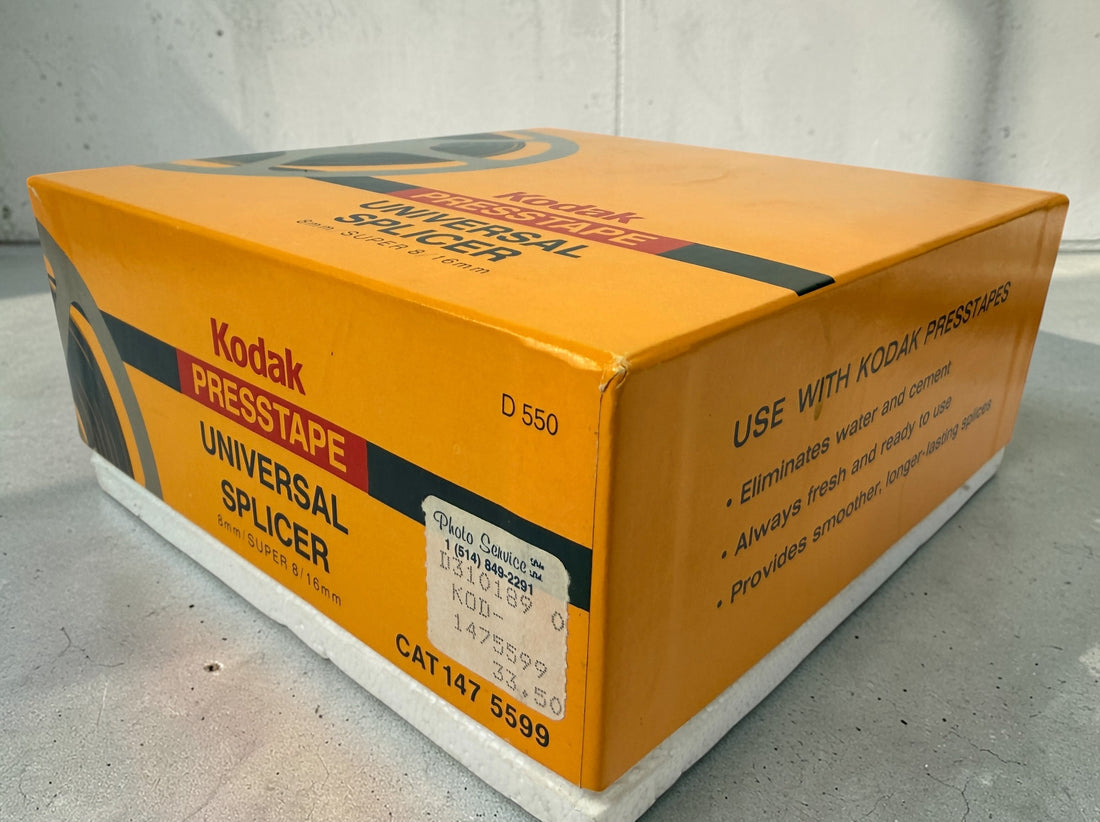 Vintage Kodak film splicer kit with Presstape tabs, 8mm Super 8 16mm editor tool in box, complete analog filmmaking accessory.