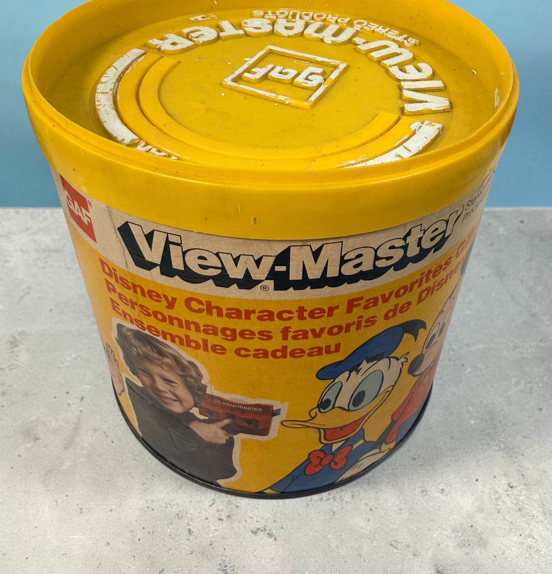 Vintage 1970s GAF View-Master Disney Gift Pak with viewer and reels. Classic 3D toy set with original canister, great collectible condition.