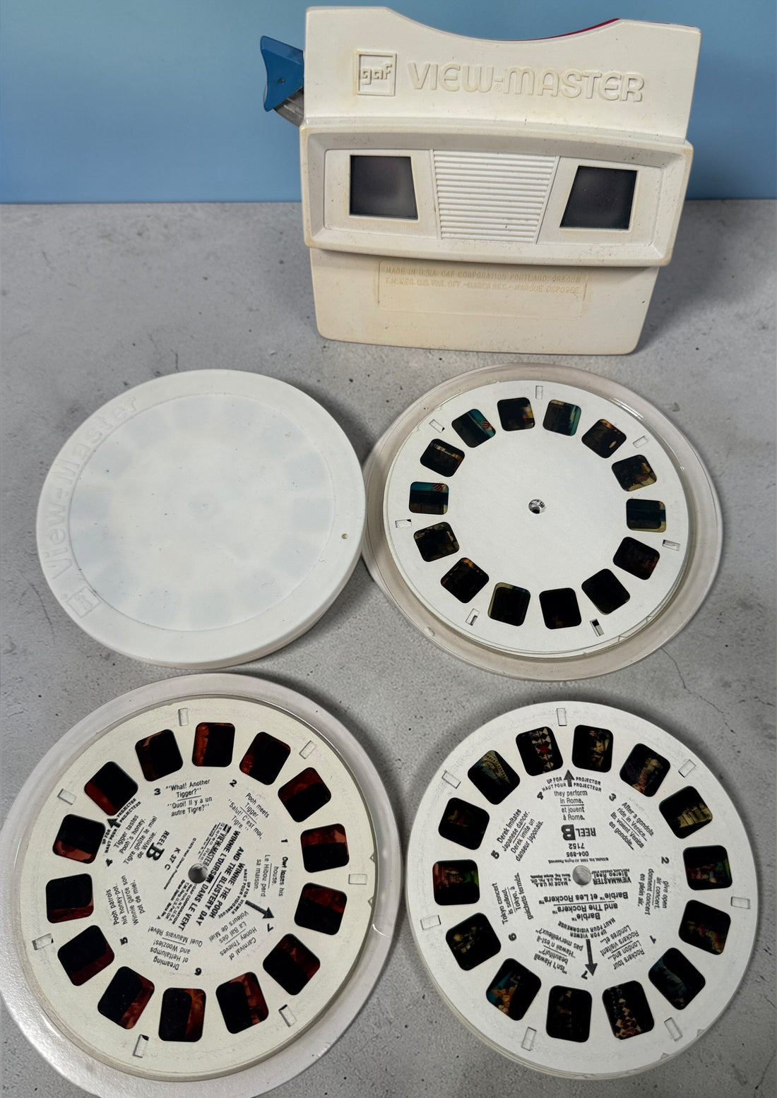 Vintage 1970s GAF View-Master Disney Gift Pak with viewer and reels. Classic 3D toy set with original canister, great collectible condition.