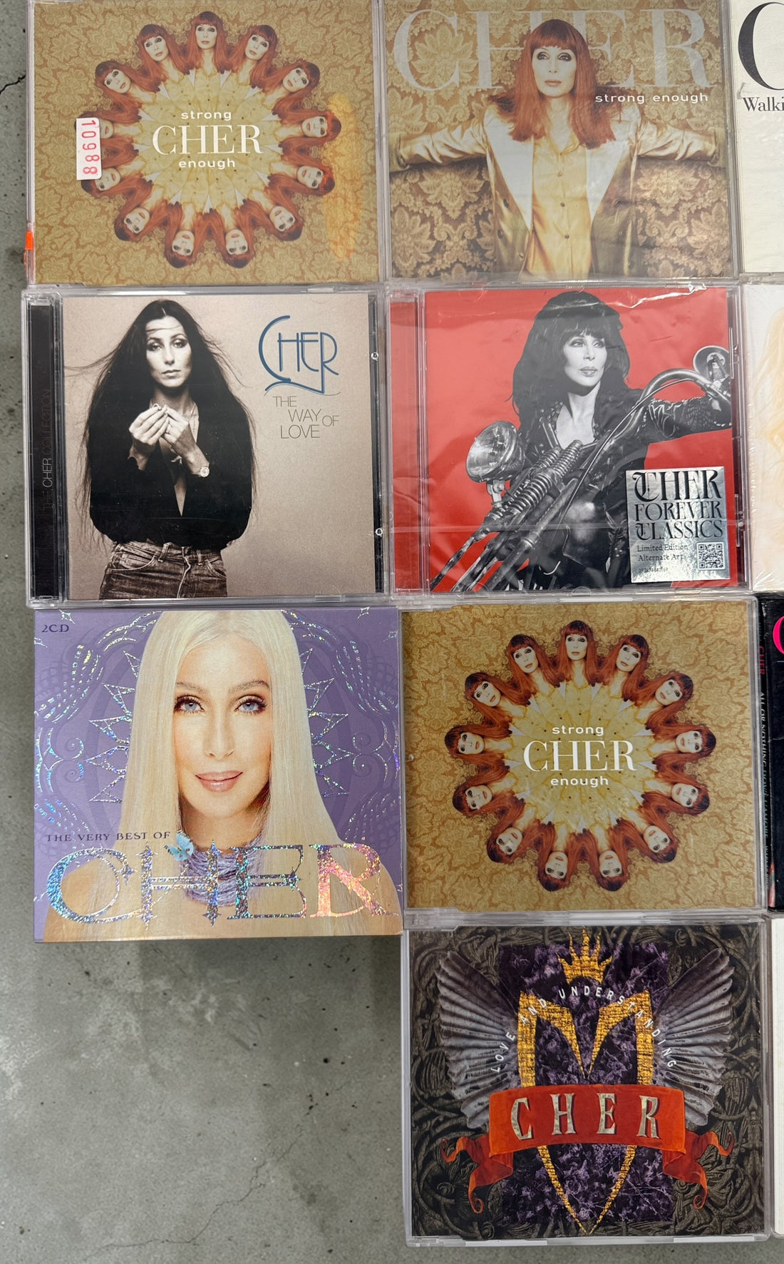 Cher CD lot of 10 albums and singles including Believe and Living Proof. Great starter collection with classic hits. Good condition with light wear.