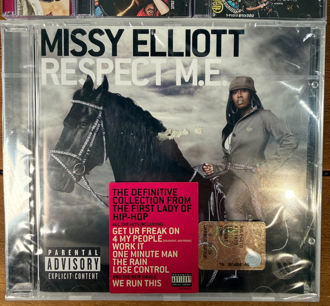 Missy Elliott CD lot featuring Respect M.E. greatest hits and hit singles including Pass That Dutch and We Run This. 2000s hip-hop bundle.