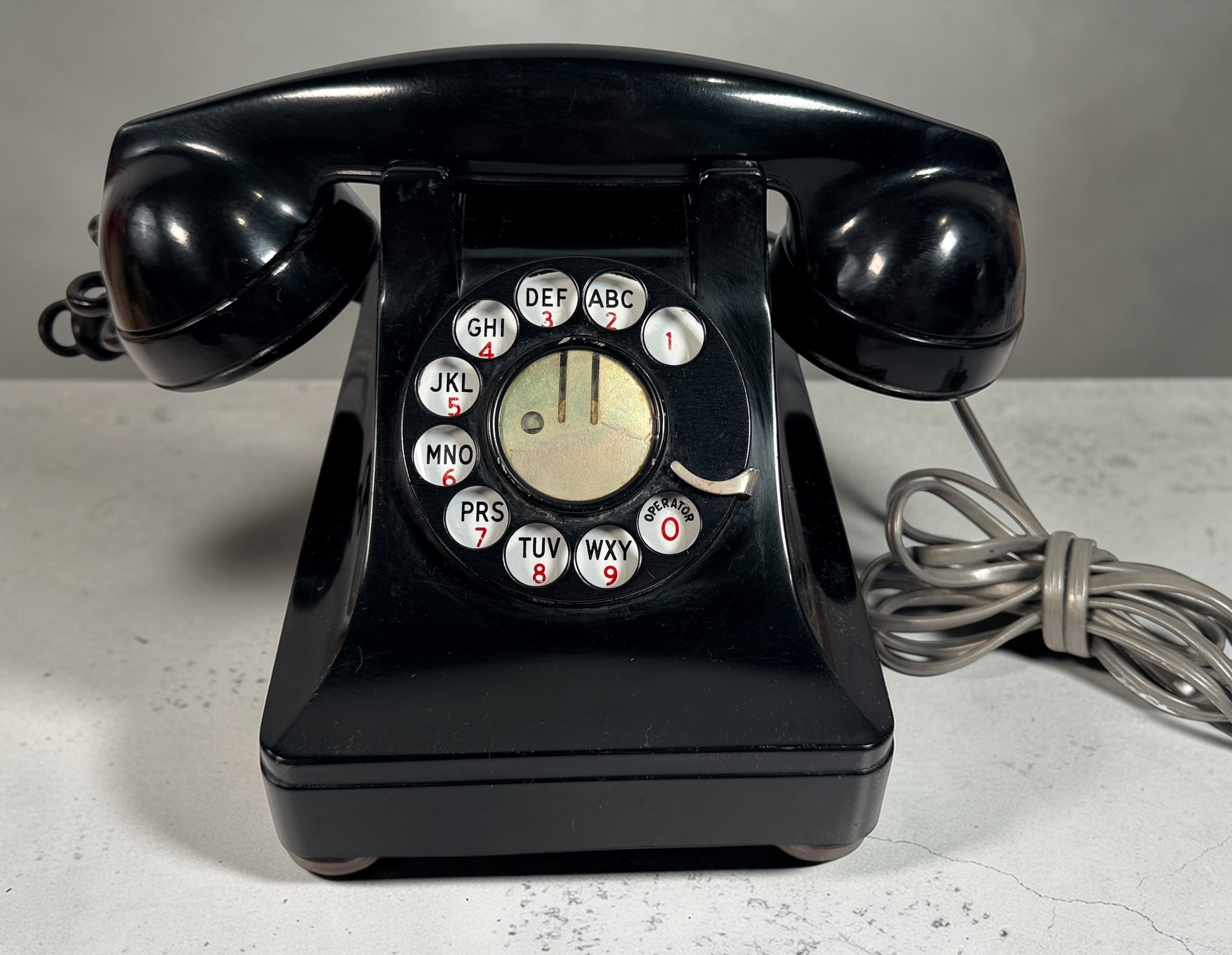 Vintage Northern Electric rotary telephone in black Bakelite, classic Canadian mid-century design. Great display piece or restoration project.