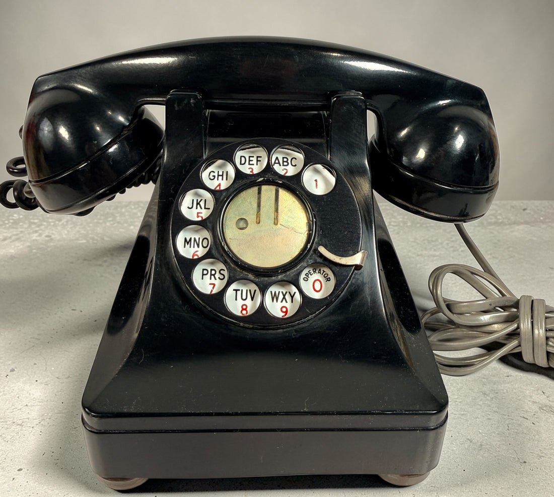 Vintage Northern Electric rotary telephone in black Bakelite, classic Canadian mid-century design. Great display piece or restoration project.