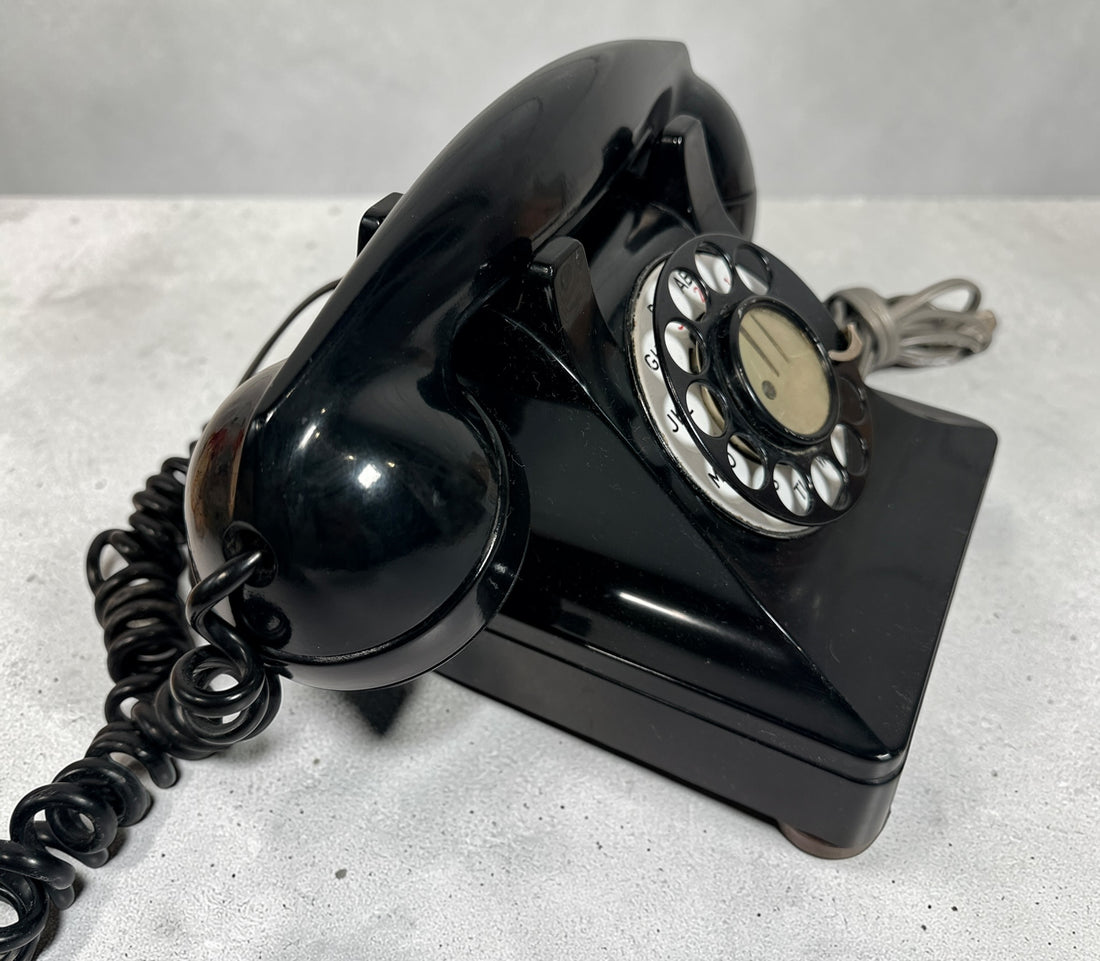 Vintage Northern Electric rotary telephone in black Bakelite, classic Canadian mid-century design. Great display piece or restoration project.