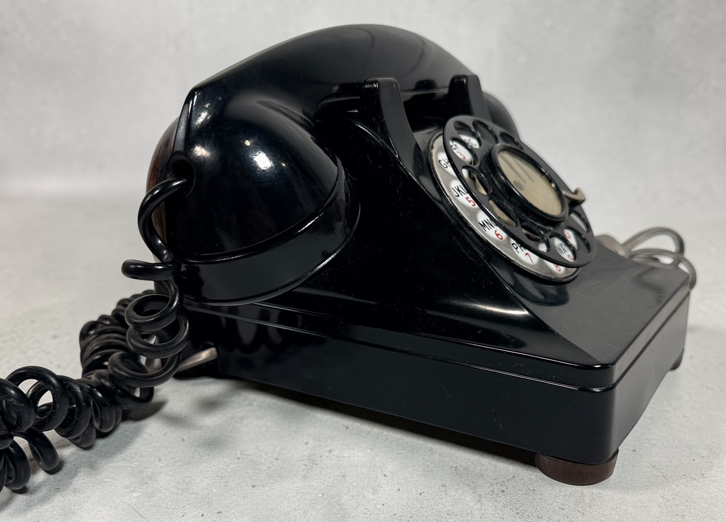Vintage Northern Electric rotary telephone in black Bakelite, classic Canadian mid-century design. Great display piece or restoration project.