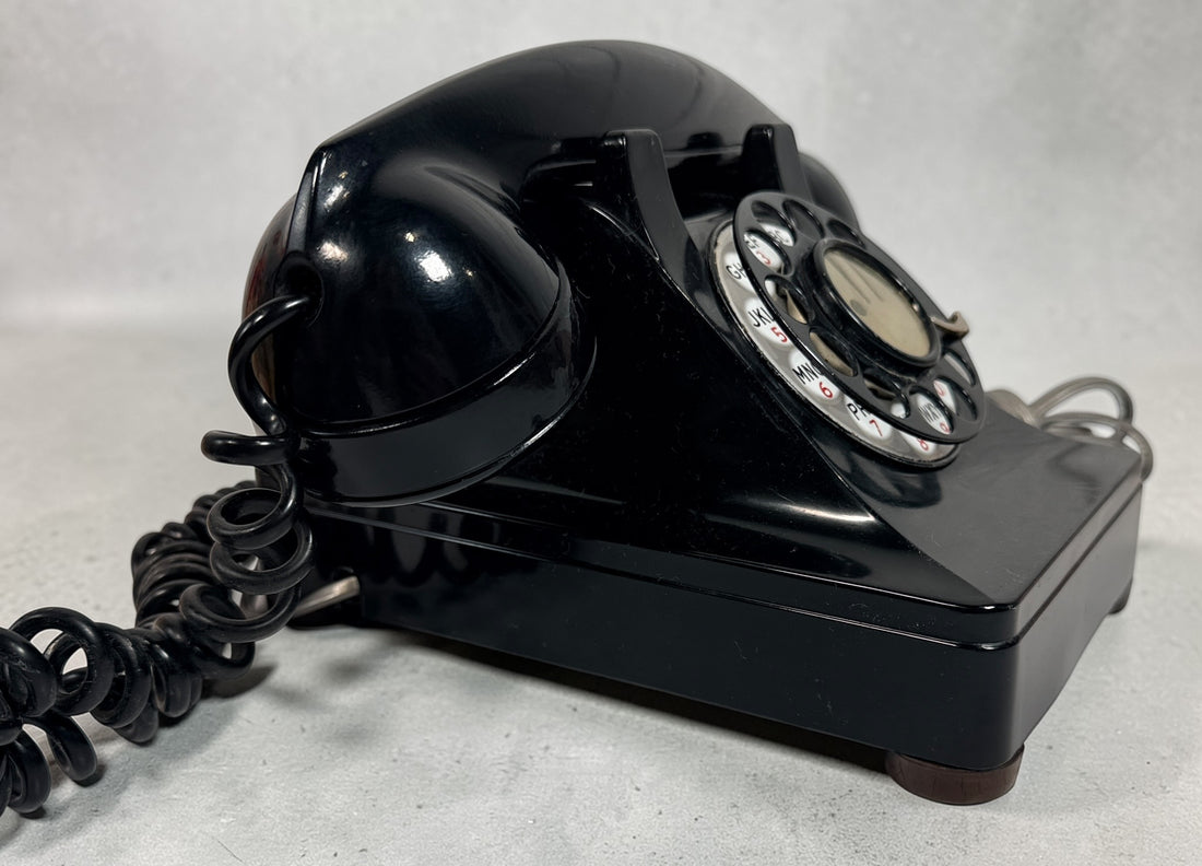 Vintage Northern Electric rotary telephone in black Bakelite, classic Canadian mid-century design. Great display piece or restoration project.