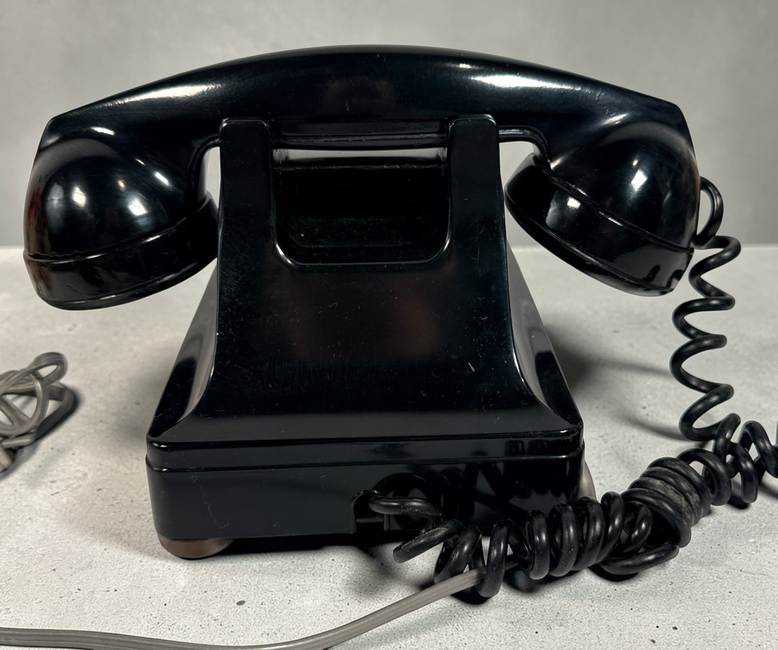 Vintage Northern Electric rotary telephone in black Bakelite, classic Canadian mid-century design. Great display piece or restoration project.