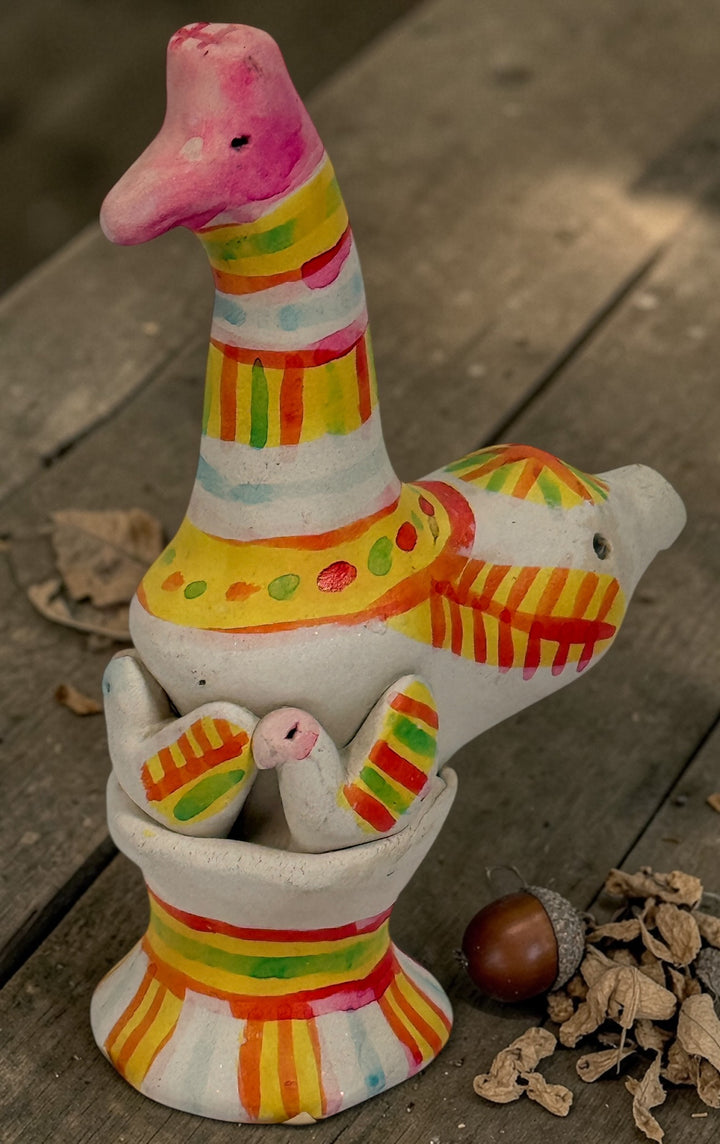 Signed Filimonovo clay whistle by Seregina, Soviet folk art bird figurine with vibrant hand-painted design, collectible Russian pottery from the 1990s.