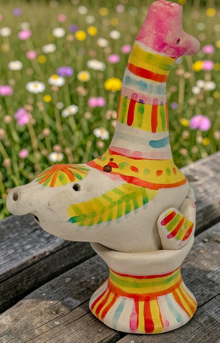 Signed Filimonovo clay whistle by Seregina, Soviet folk art bird figurine with vibrant hand-painted design, collectible Russian pottery from the 1990s.