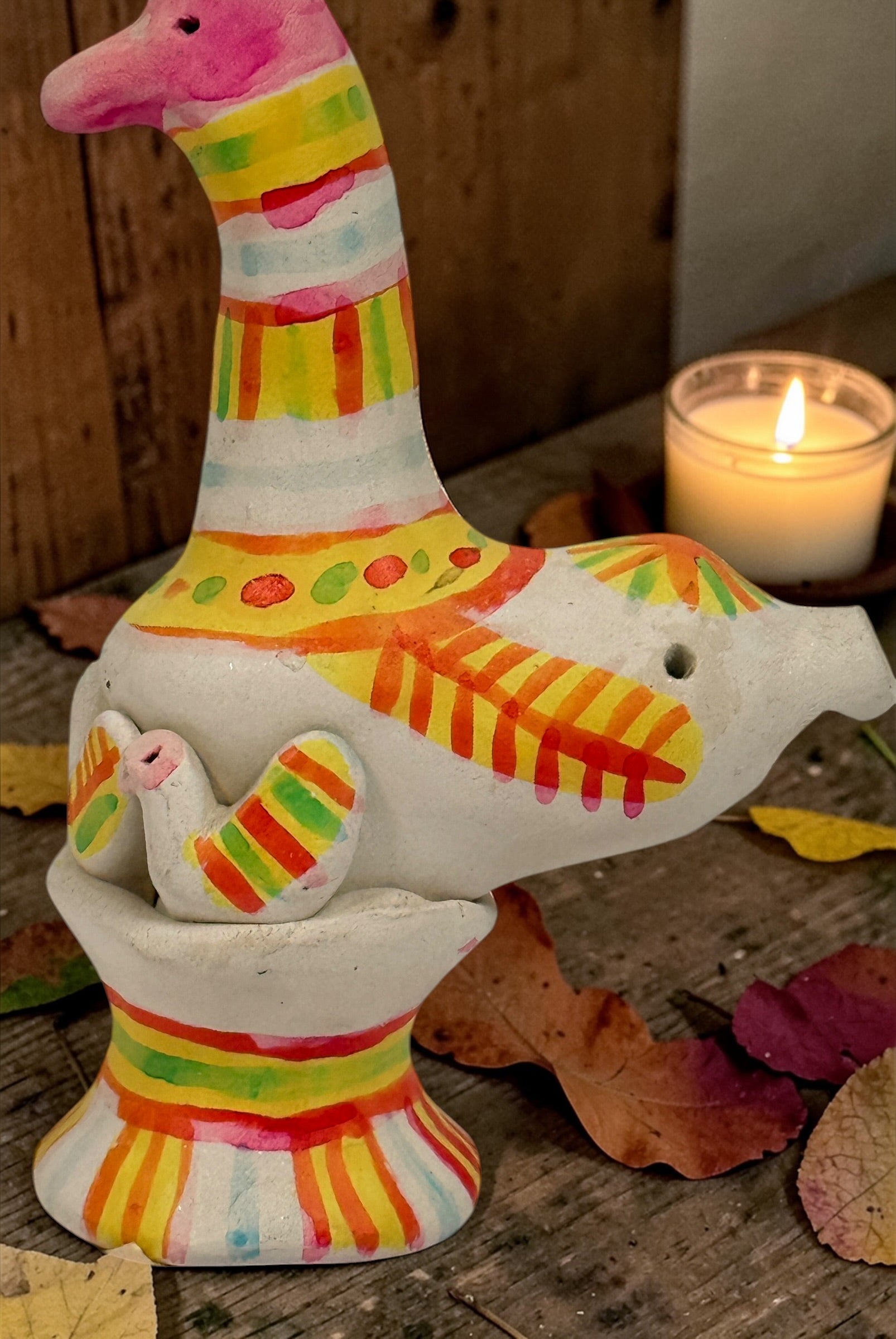 Signed Filimonovo clay whistle by Seregina, Soviet folk art bird figurine with vibrant hand-painted design, collectible Russian pottery from the 1990s.