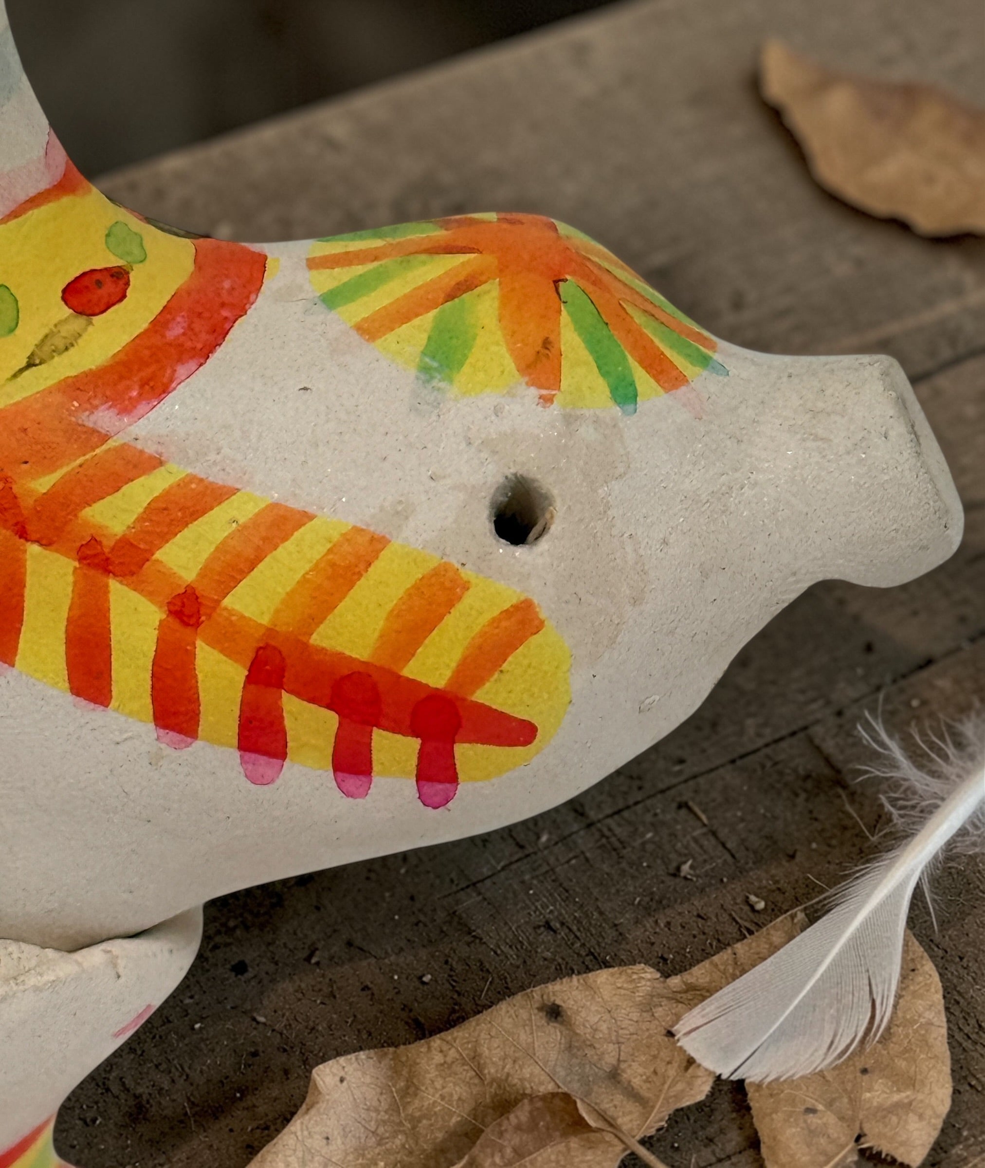 Signed Filimonovo clay whistle by Seregina, Soviet folk art bird figurine with vibrant hand-painted design, collectible Russian pottery from the 1990s.