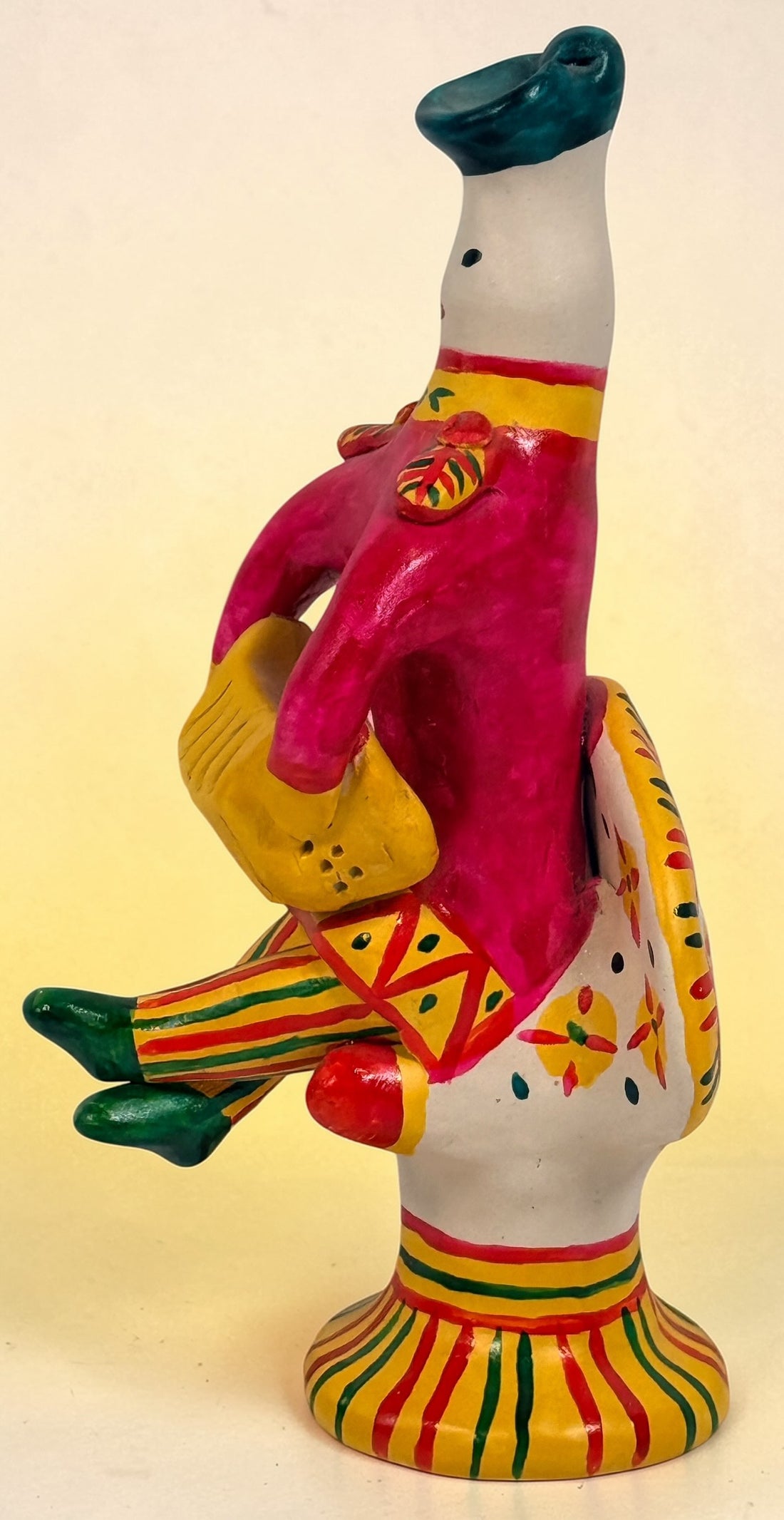 Vintage Russian folk art ceramic figurine, hand painted seated woman with basket, colorful Eastern European decorative pottery collectible.