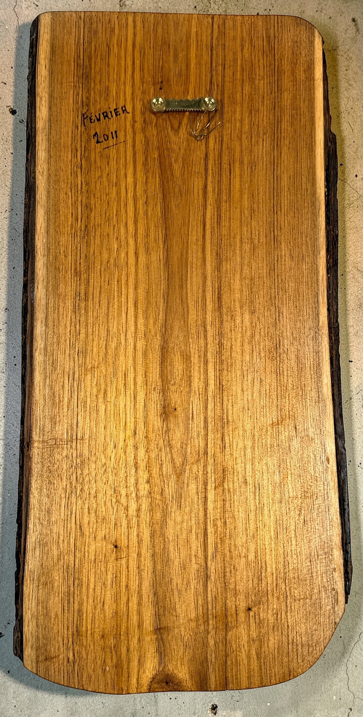 Hand carved raccoon wood wall plaque signed M Ouimet 16 inch rustic Quebec folk art wildlife carving lodge decor live edge wood collectible.