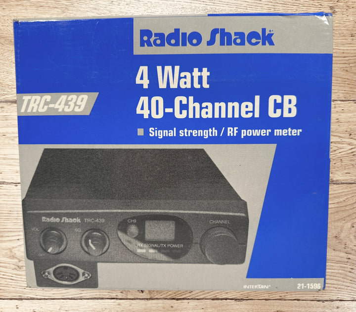 Vintage Radio Shack TRC-439 CB radio with mic and box. 40-channel mobile transceiver, clean condition, ideal for collectors or retro communication setups.
