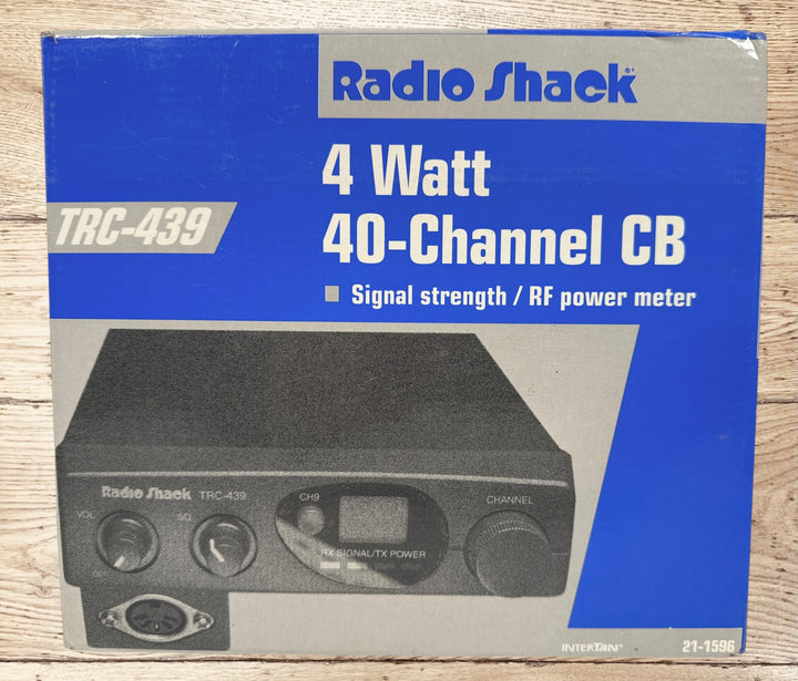 Vintage Radio Shack TRC-439 CB radio with mic and box. 40-channel mobile transceiver, clean condition, ideal for collectors or retro communication setups.
