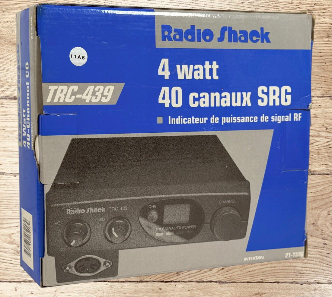 Vintage Radio Shack TRC-439 CB radio with mic and box. 40-channel mobile transceiver, clean condition, ideal for collectors or retro communication setups.