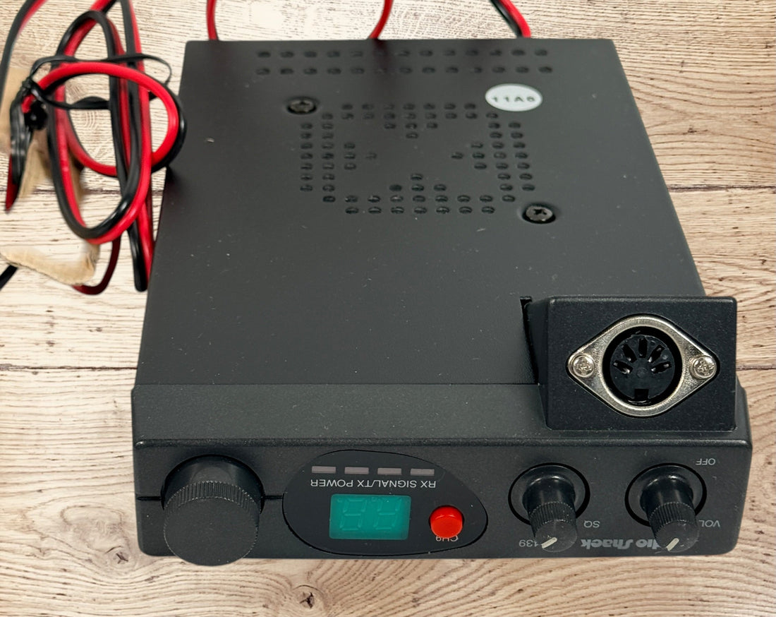 Vintage Radio Shack TRC-439 CB radio with mic and box. 40-channel mobile transceiver, clean condition, ideal for collectors or retro communication setups.