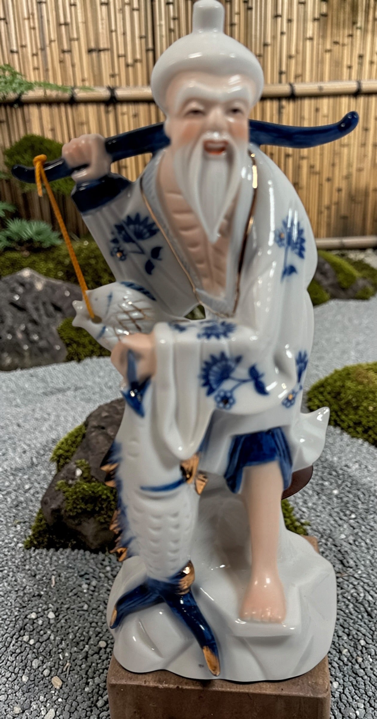 Vintage Japanese porcelain fisherman figurines pair blue white gold mid century export decor collectible Asian style display statues Japan.