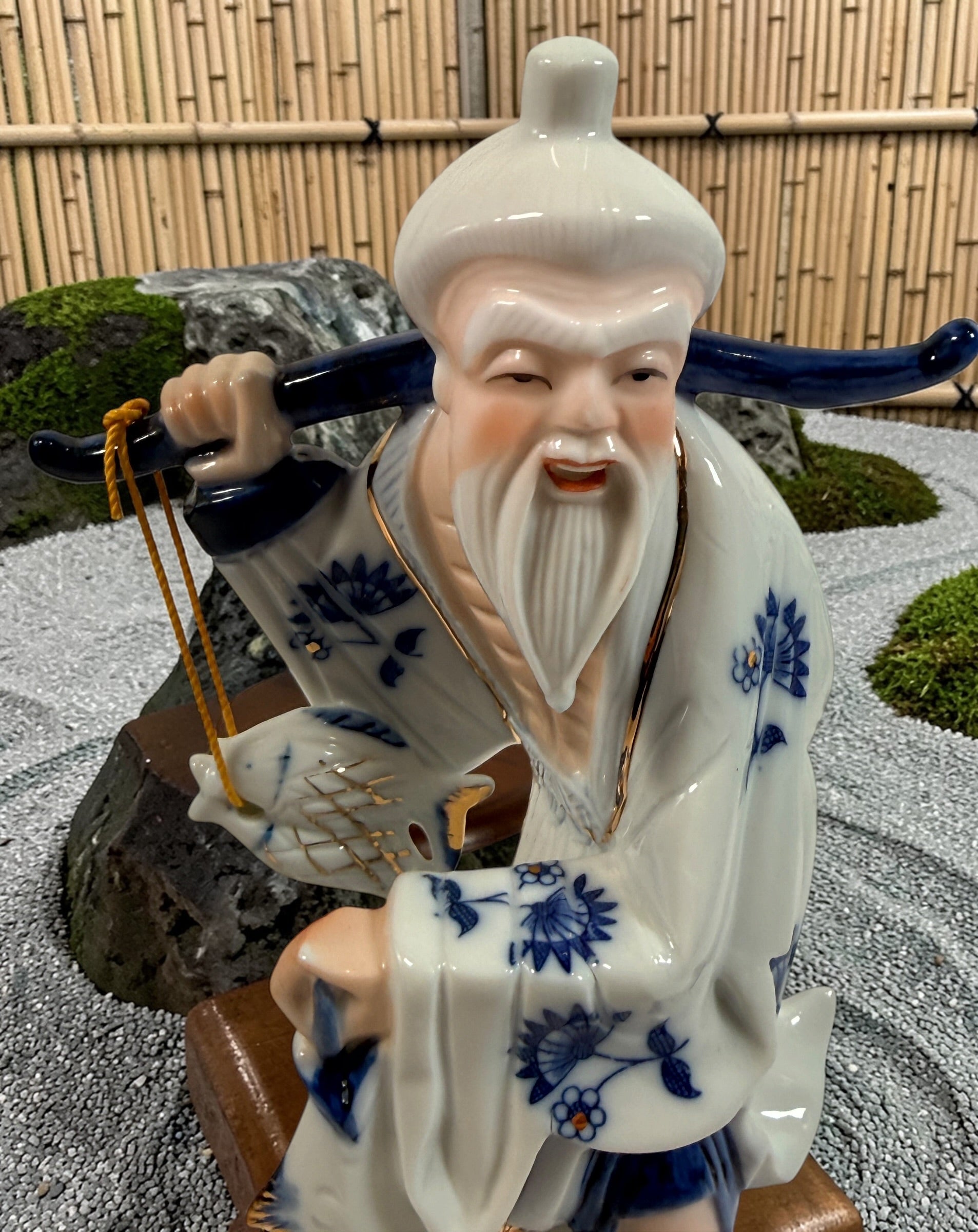 Vintage Japanese porcelain fisherman figurines pair blue white gold mid century export decor collectible Asian style display statues Japan.