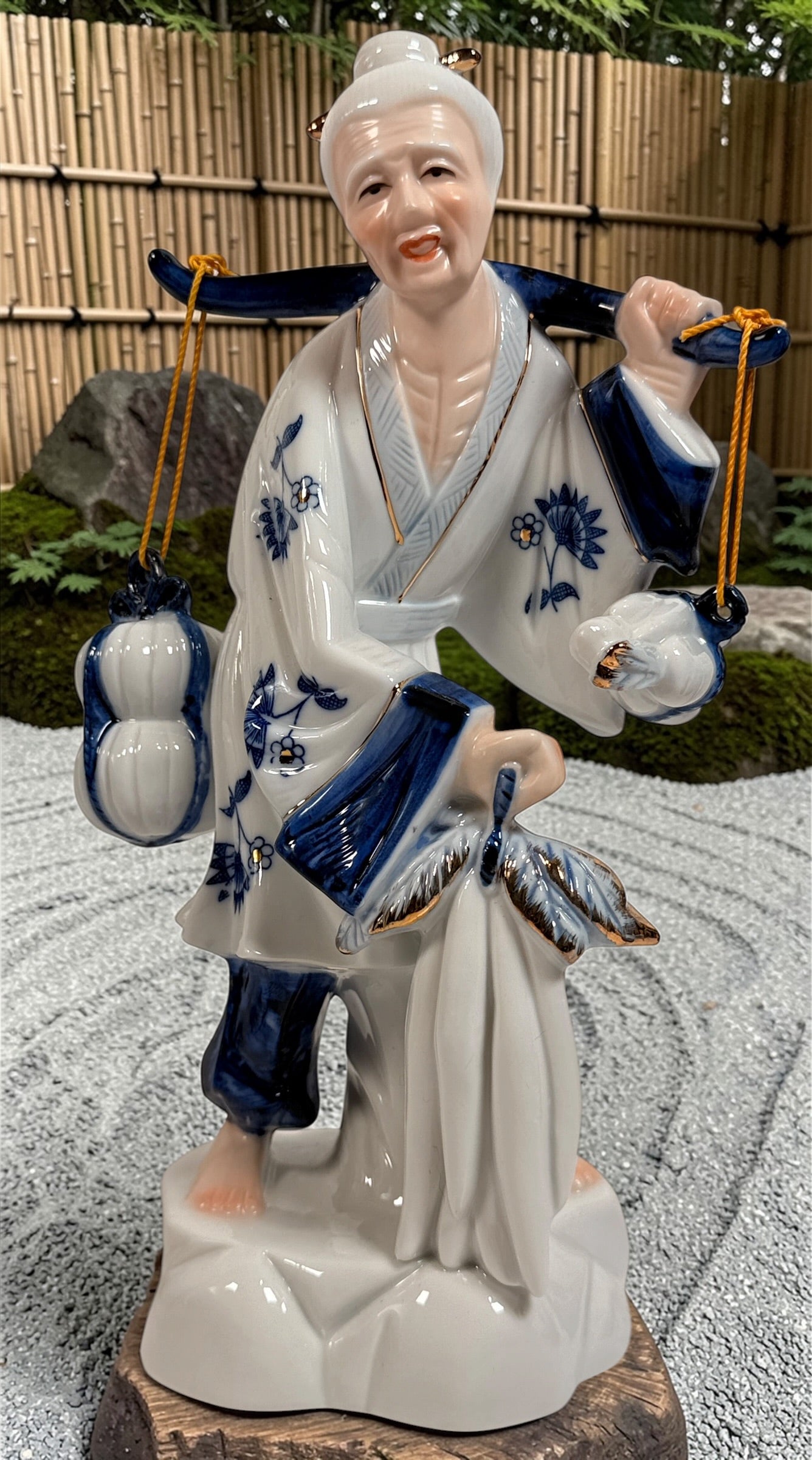 Vintage Japanese porcelain fisherman figurines pair blue white gold mid century export decor collectible Asian style display statues Japan.