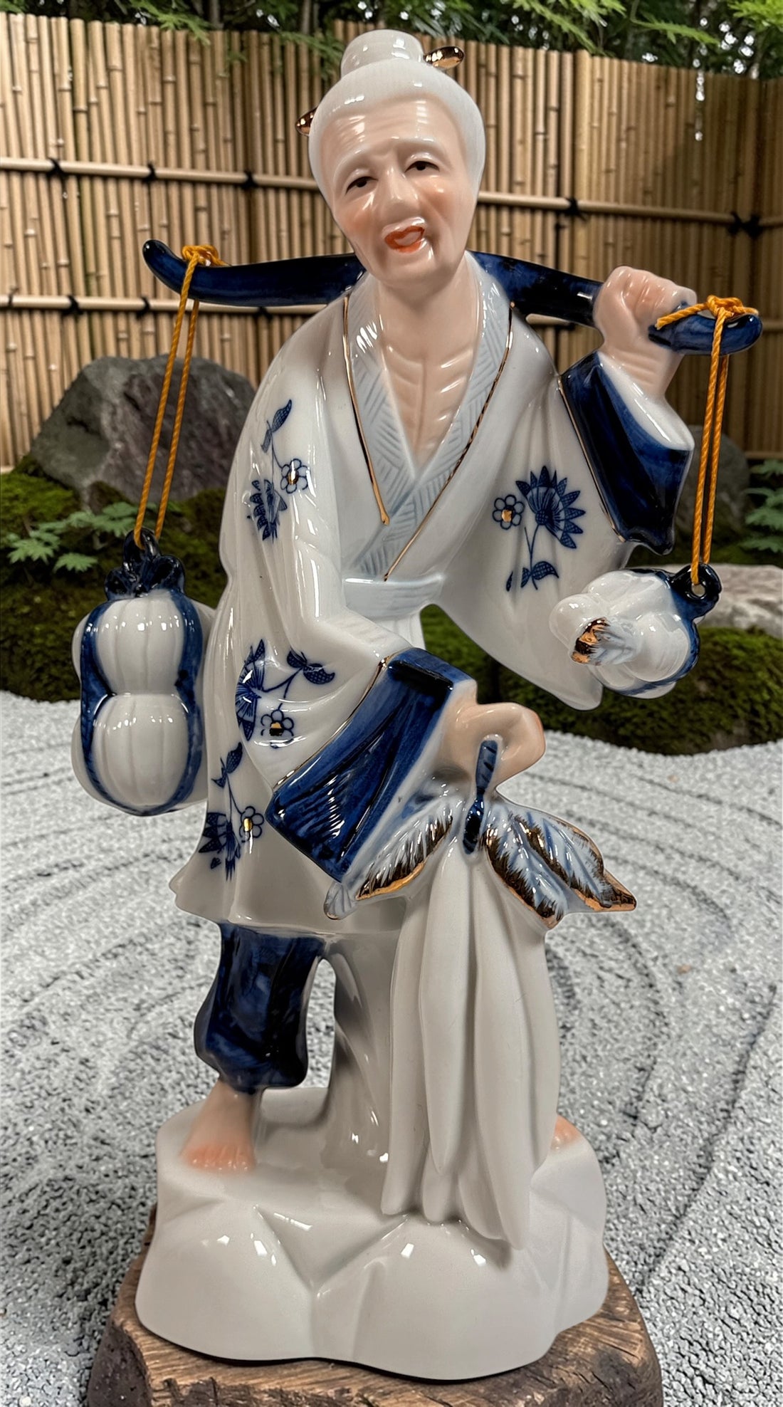 Vintage Japanese porcelain fisherman figurines pair blue white gold mid century export decor collectible Asian style display statues Japan.