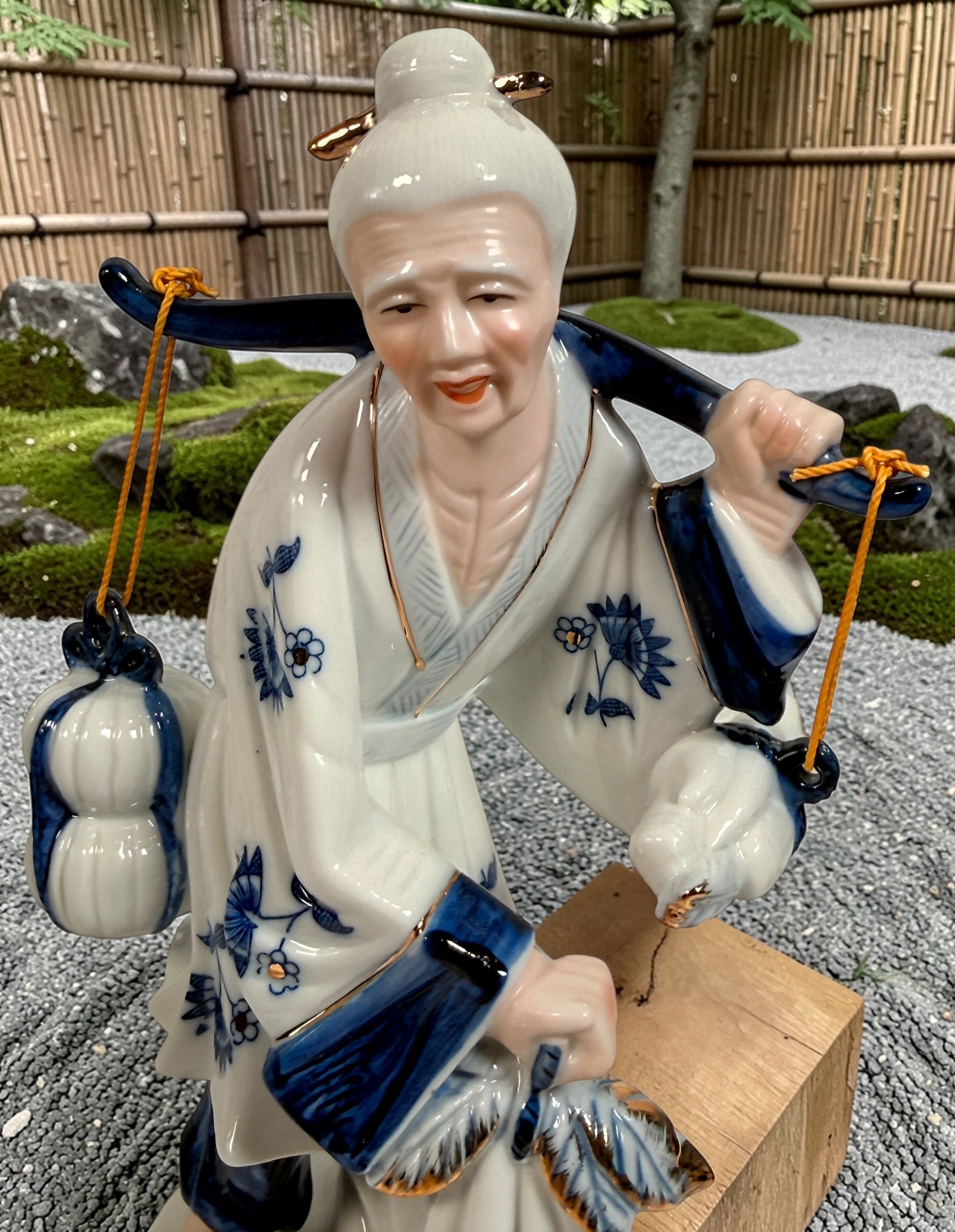 Vintage Japanese porcelain fisherman figurines pair blue white gold mid century export decor collectible Asian style display statues Japan.
