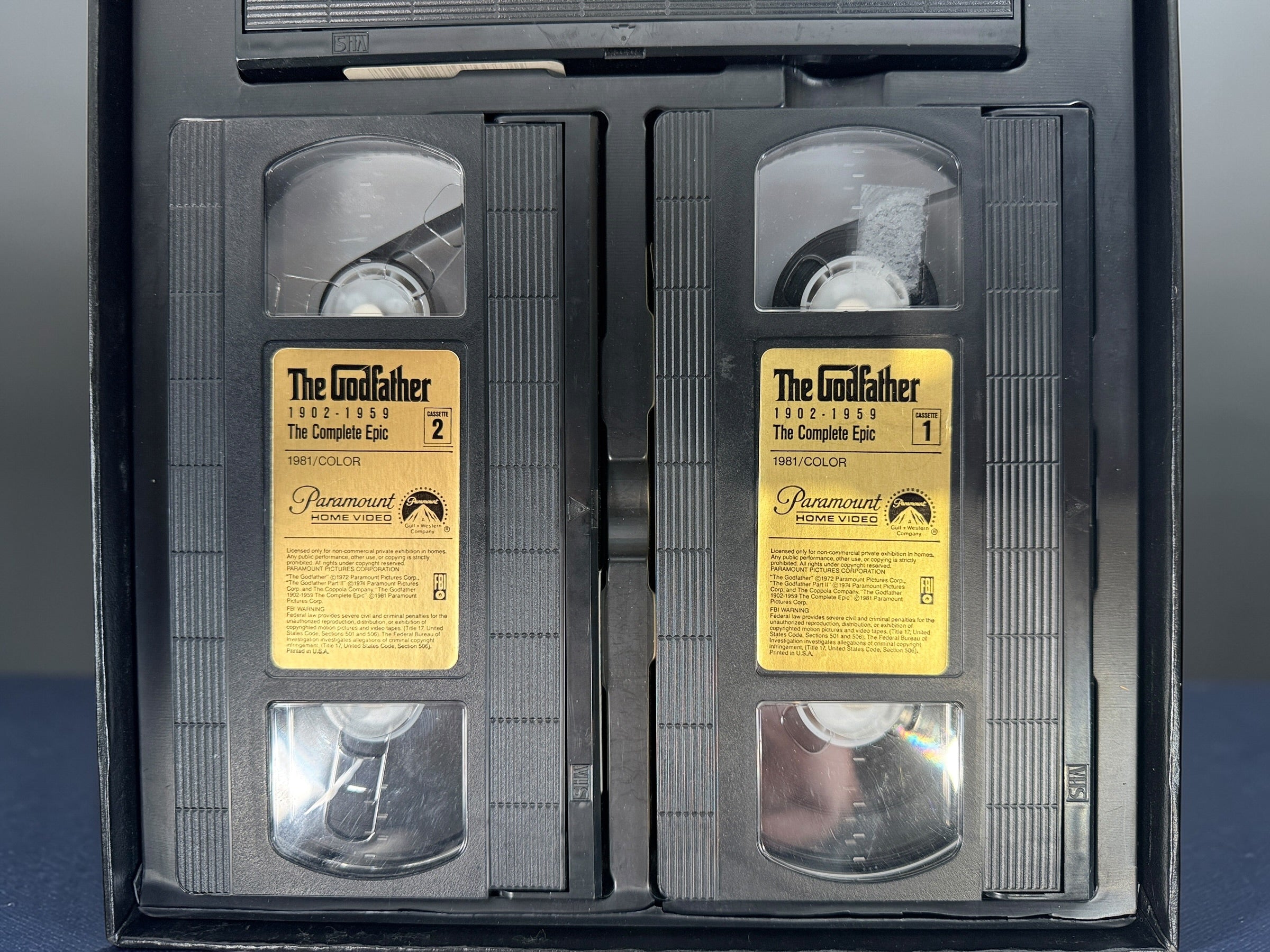 Vintage Godfather Complete Epic VHS box set with 3 tapes and booklet. Chronological edition from Paramount, collectible classic film release.