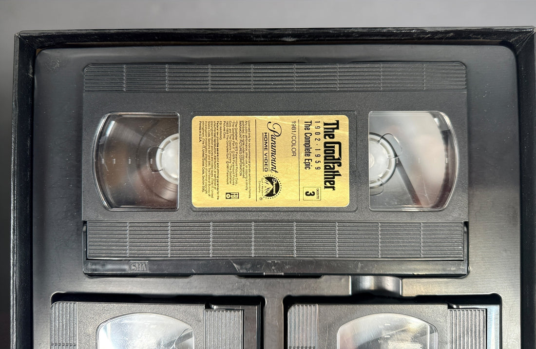 Vintage Godfather Complete Epic VHS box set with 3 tapes and booklet. Chronological edition from Paramount, collectible classic film release.