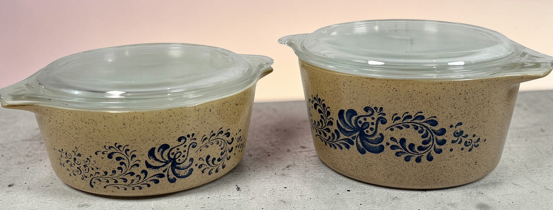 Vintage Pyrex Homestead blue floral mixing bowls and casserole dishes with lids. Classic farmhouse kitchenware set, durable glass, collectible and practical.